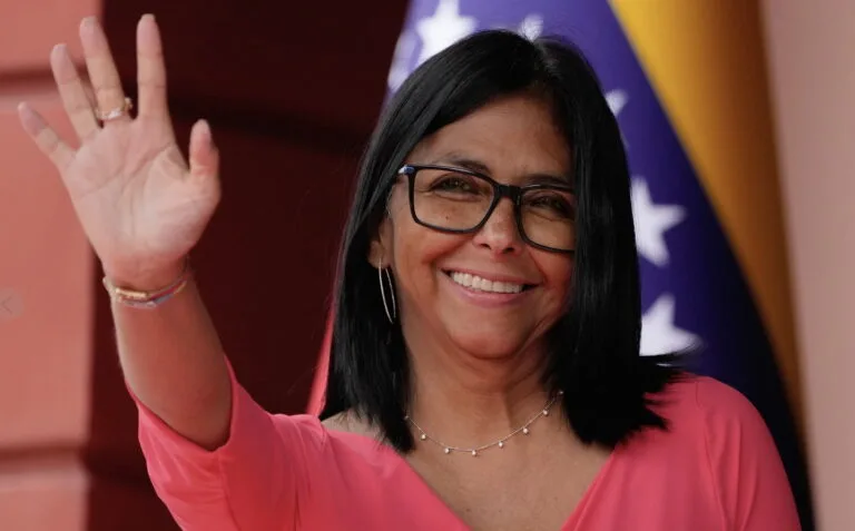 Venezuela’s acting President Delcy Rodríguez waves as she waits for Colombian President Gustavo Petro in Caracas, Venezula, Friday, April 24, 2026.