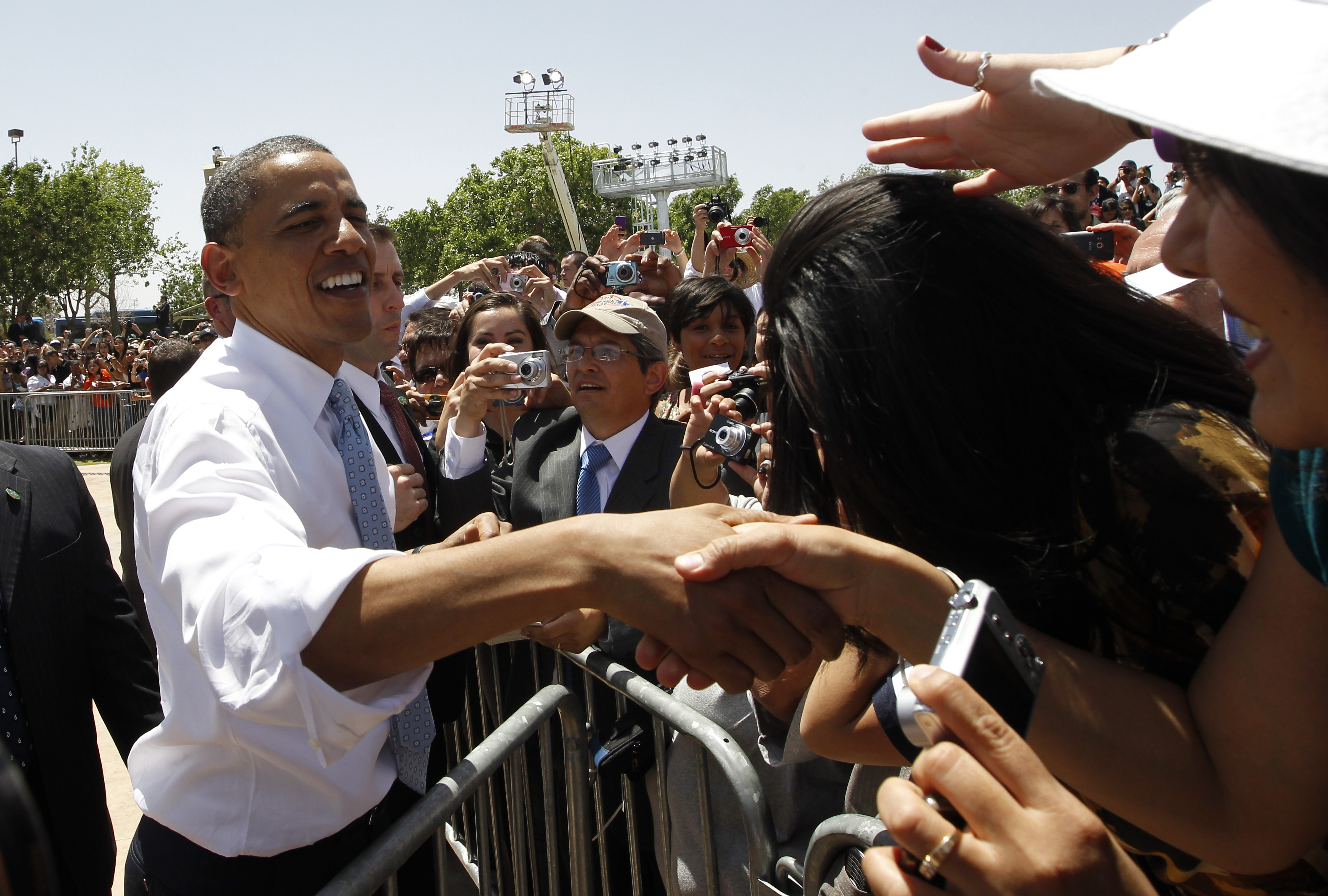 President Barack Obama greets audience members after he speaks about immigration reform at Chamizal National Memorial Park in El Paso, Texas, as he visits the U.S.-Mexico border, Tuesday, May 10, 2011