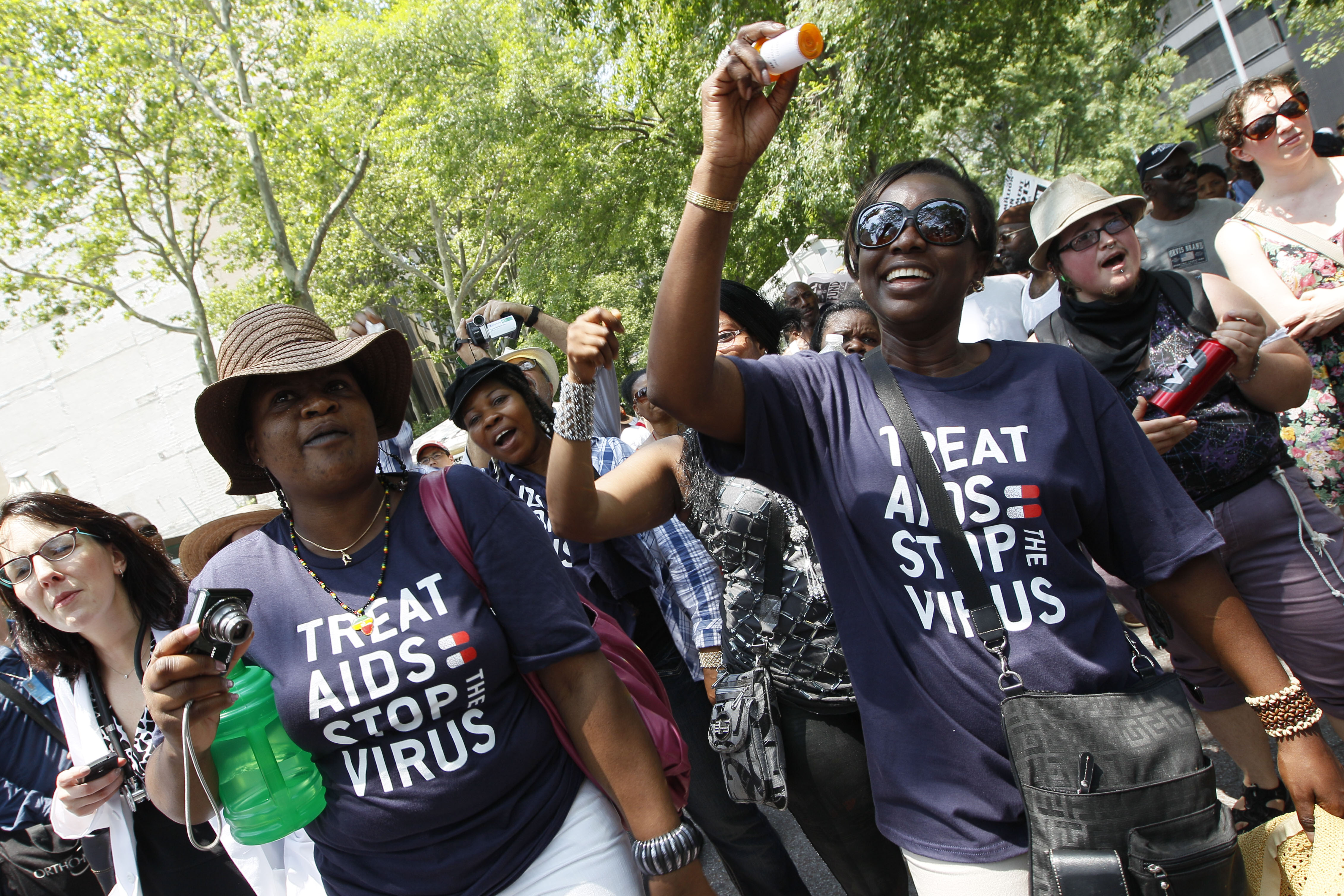 AIDS activists chant slogans while shaking medicine bottles during a demonstration, Wednesday, June 8, 2011 in New York. On the first day of of a gathering of world leaders at a UN-sponsored High Level Meeting on HIV and AIDS, AIDS activists from around the world rally outside the United Nations headquarters calling for full funding for global AIDS treatment and prevention.