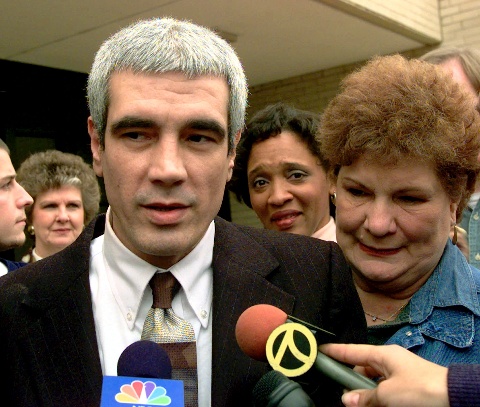 Kerry Max Cook with his mother Evelyn at his side speaks to the media after he was released from the Smith County Jail in Tyler, Texas, Tuesday Nov. 11, 1997. Cook, a former Texas death row inmate, had been jailed pending his fourth trial for capital murder.