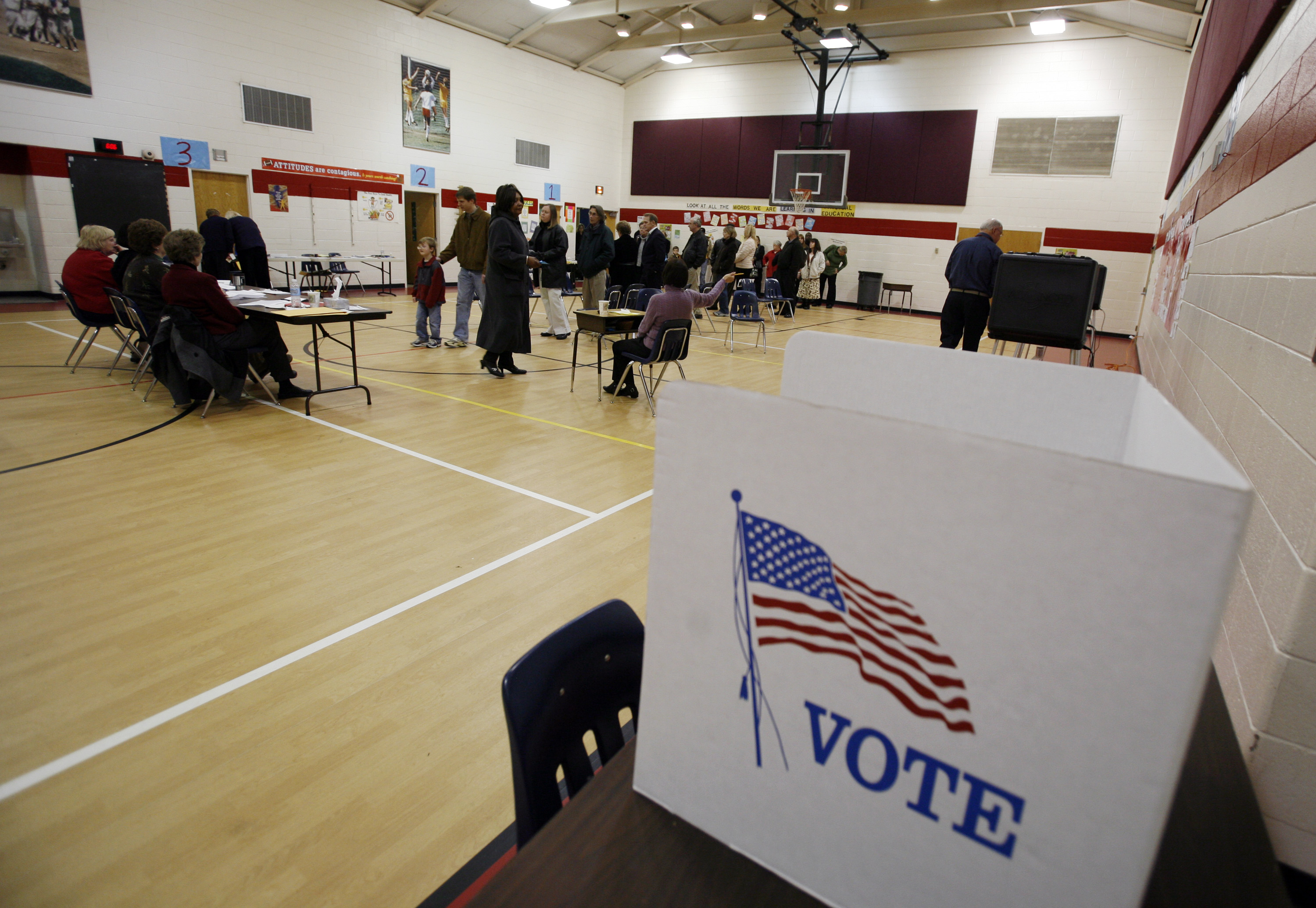 Voters line up to vote in the presidential primary at Gayton Elementary School's gymnasium in Richmond, Va., Tuesday, Feb. 12, 2008.