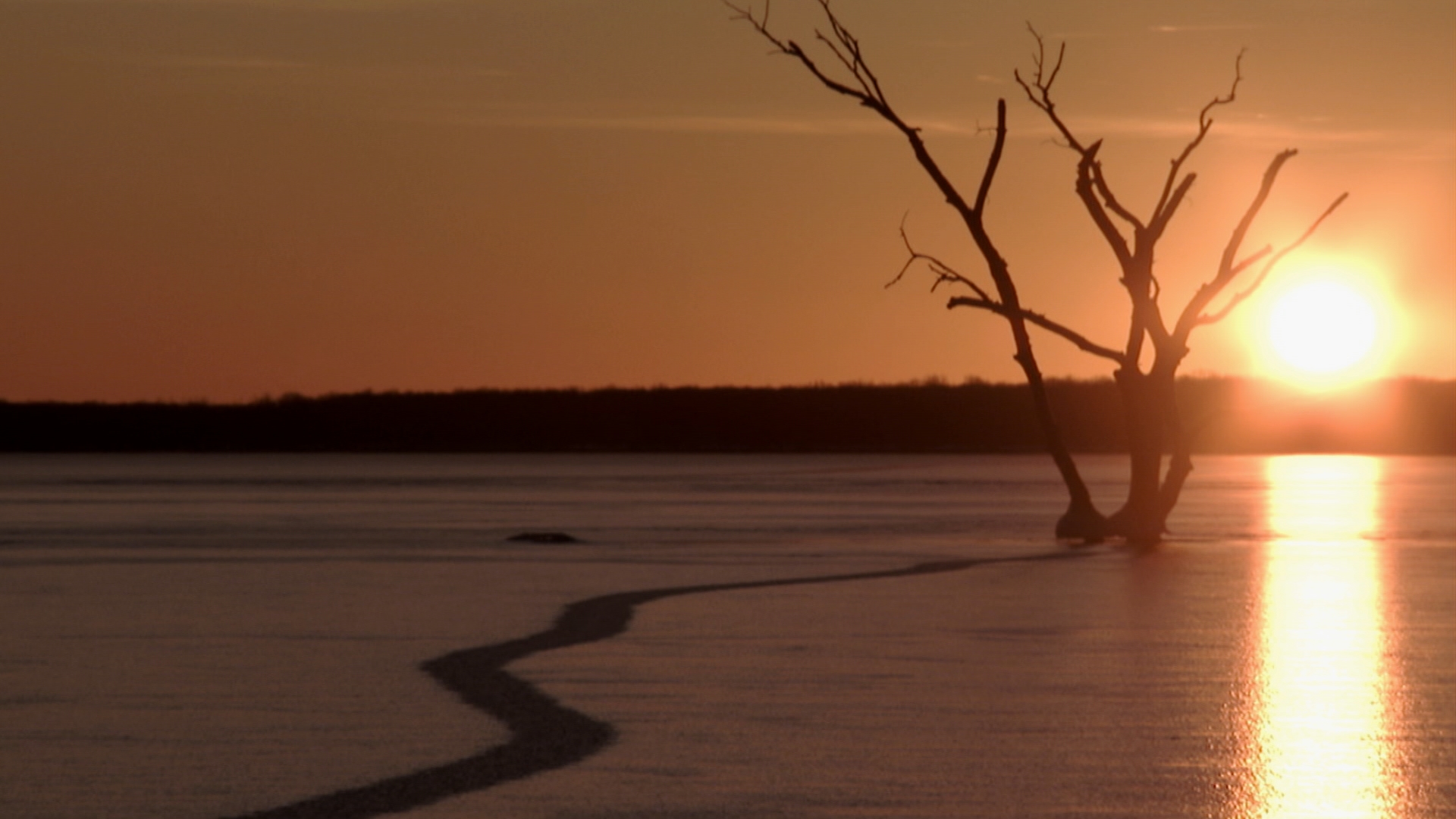 The sun rises over Spirit Lake.