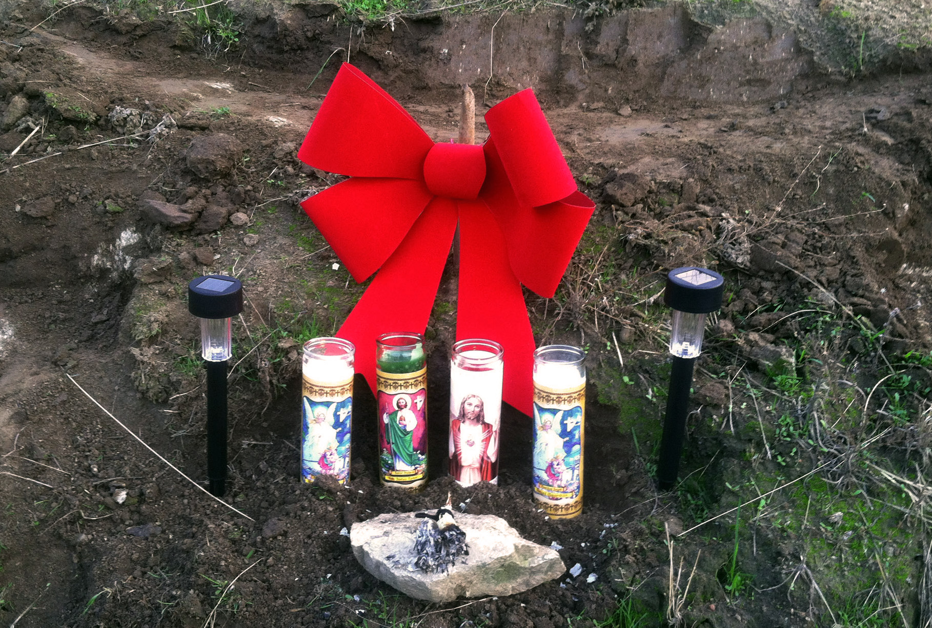 A makeshift memorial on the Tule River Indian Reservation near Porterville, Calif., where a man killed his mother and two uncles, and shot his three children before being killed in a shootout with police on Saturday. (AP Photo/The Fresno Bee, Lew Griswold)