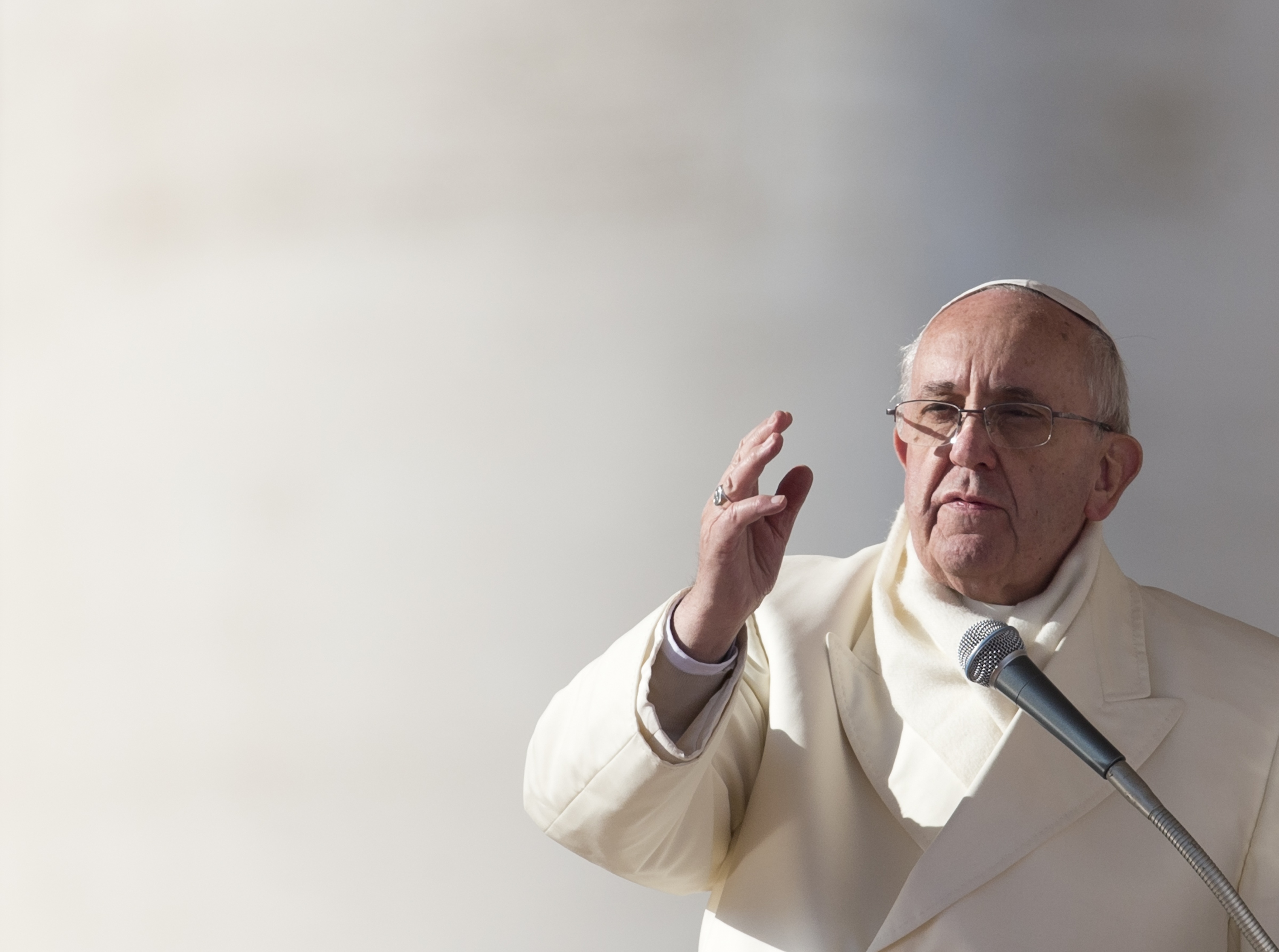Pope Francis delivers his blessing at the end of his weekly general audience in St. Peter's Square at the Vatican, Wednesday, Dec. 11, 2013. (AP Photo/Alessandra Tarantino)
