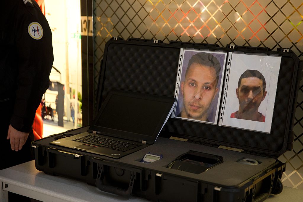 A picture taken on December 3, 2015 at the Roissy-Charles-de-Gaulle airport in Roissy-en-France, outside Paris shows the wanted notice of terrorist Salah Abdeslam (L) and Mohamed Abrini.  / AFP / KENZO TRIBOUILLARD        (Photo credit should read KENZO TRIBOUILLARD/AFP/Getty Images)