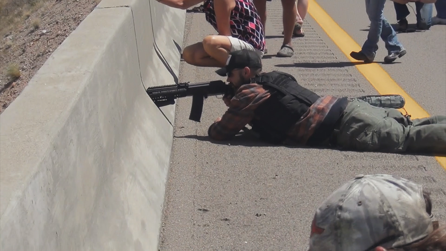 Eric Parker aims a rifle on an overpass overlooking federal agents during the Bunkerville standoff in April 2014.