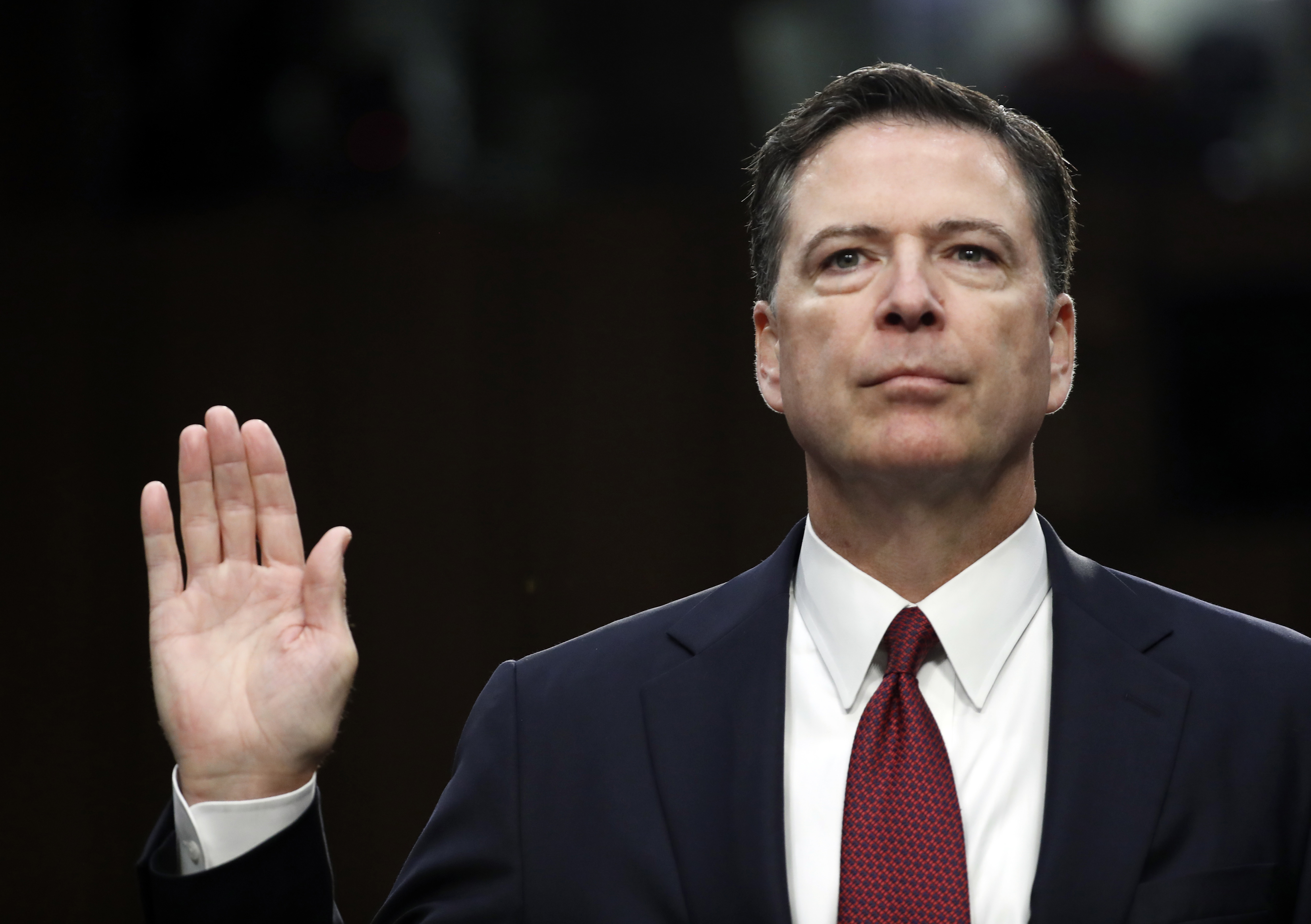 Former FBI director James Comey is sworn in during a Senate Intelligence Committee hearing on Capitol Hill, June 8, 2017.