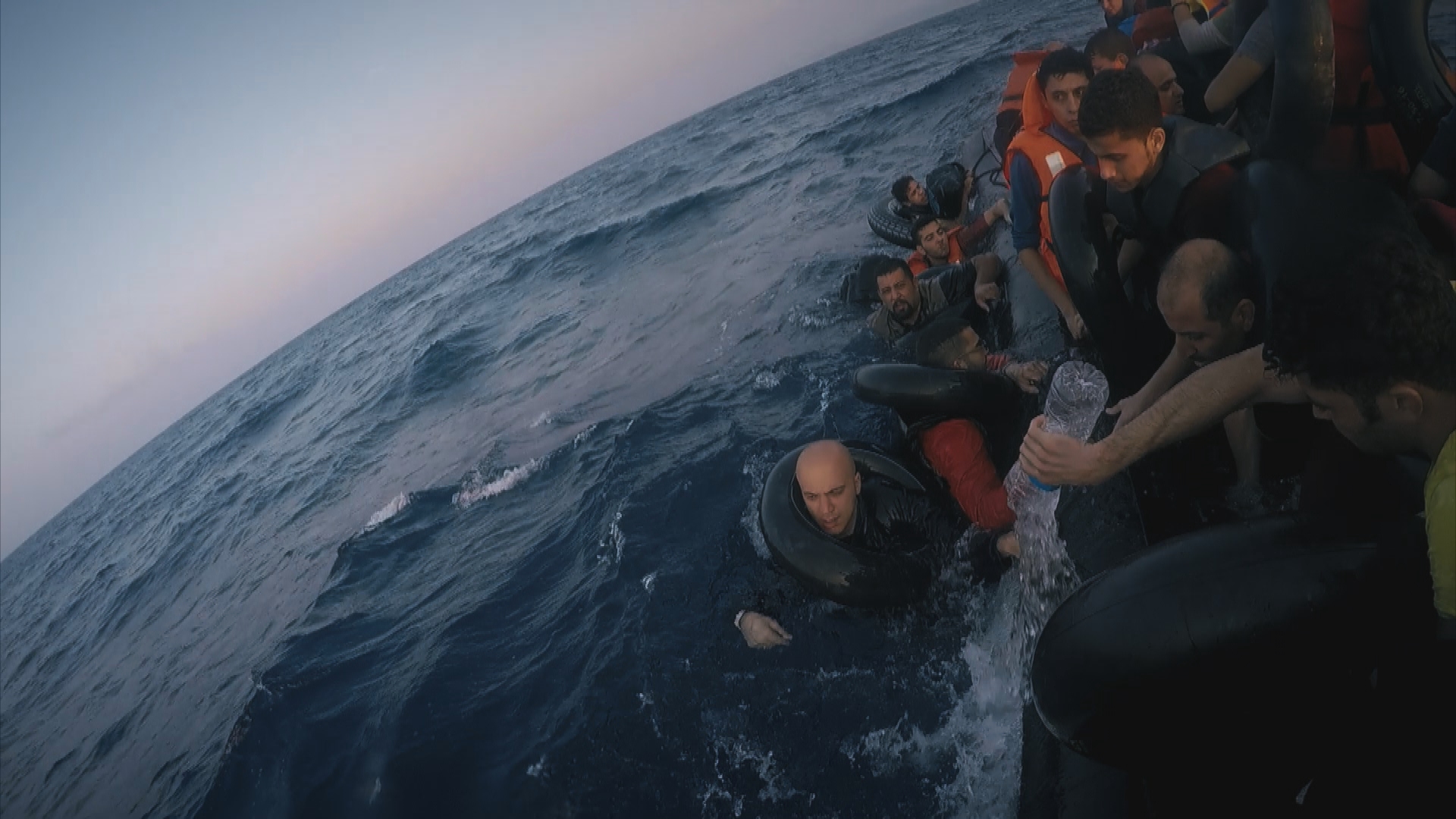 Refugees crossed the Mediterranean Sea in a sinking dinghy in this scene from FRONTLINE's duPont Award-winning documentary, "Exodus."