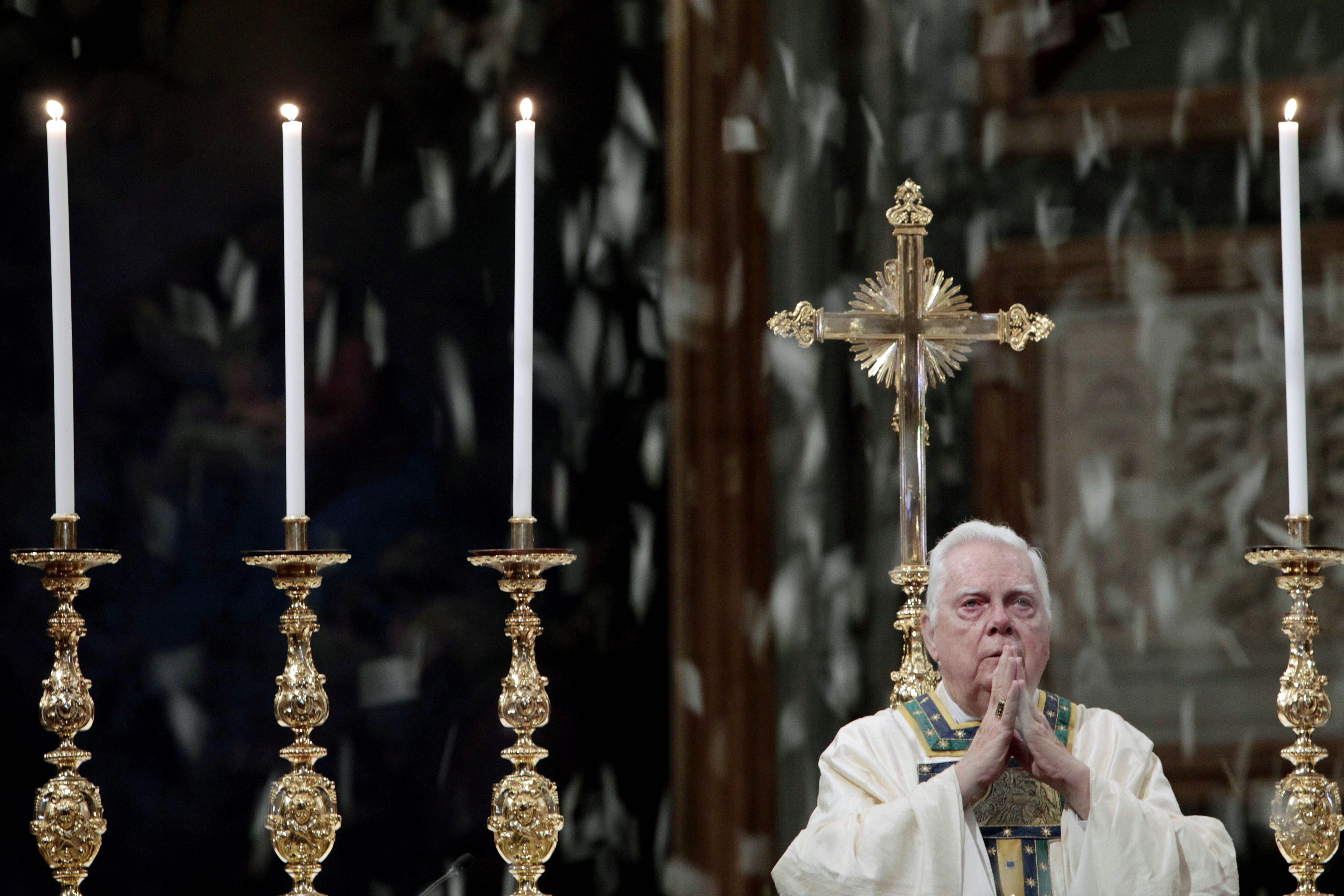 White rose petals, symbolizing snow, drop from the ceiling of St. Mary Major's Basilica during Cardinal Bernard Law's Mass at a ceremony for Our Lady of the Snows, in Rome, Friday, Aug. 5, 2011. (AP Photo/Gregorio Borgia)