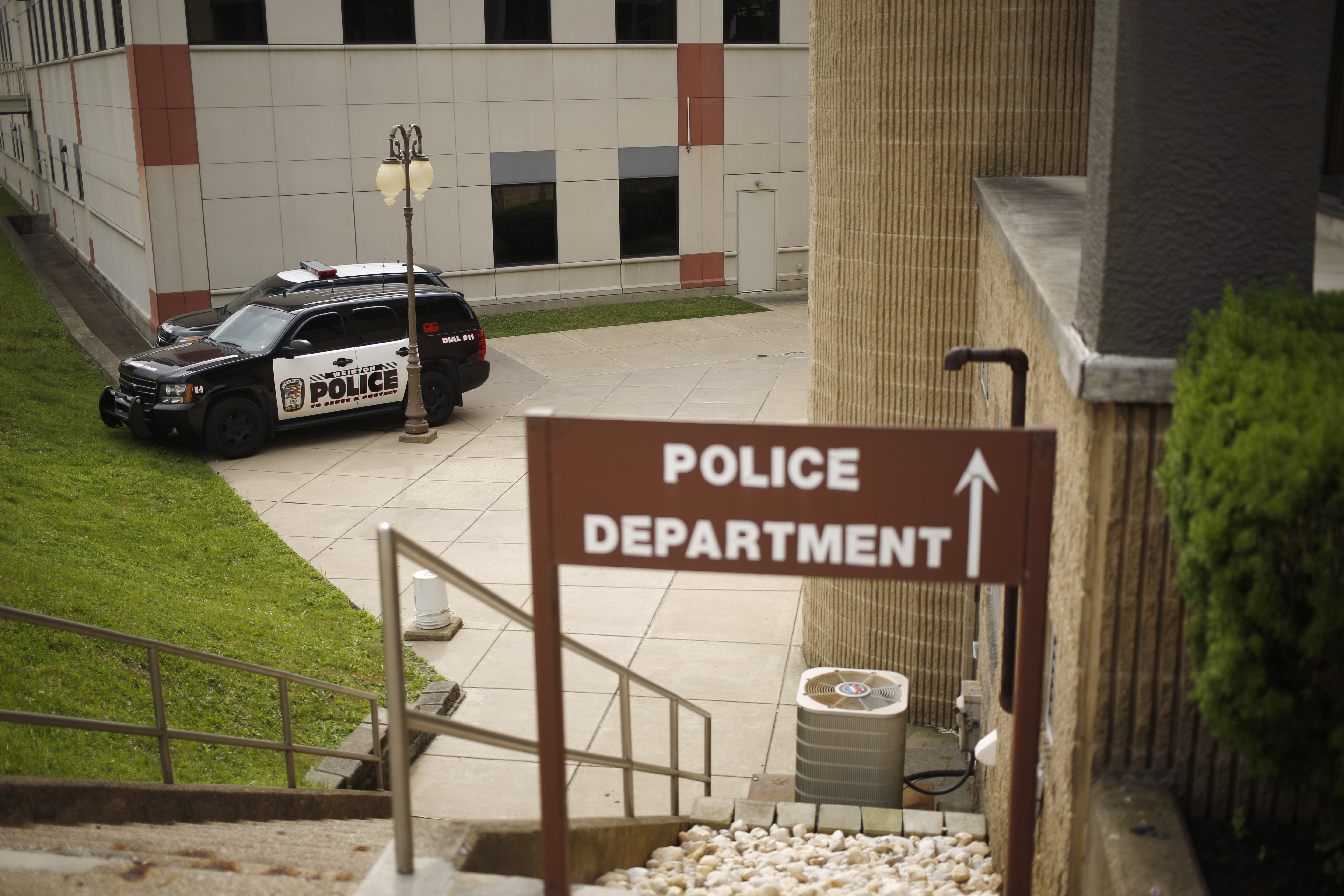 Police cruisers sit parked outside the Weirton Police Department on Wednesday, June 20, 2018 in Weirton, W.Va.