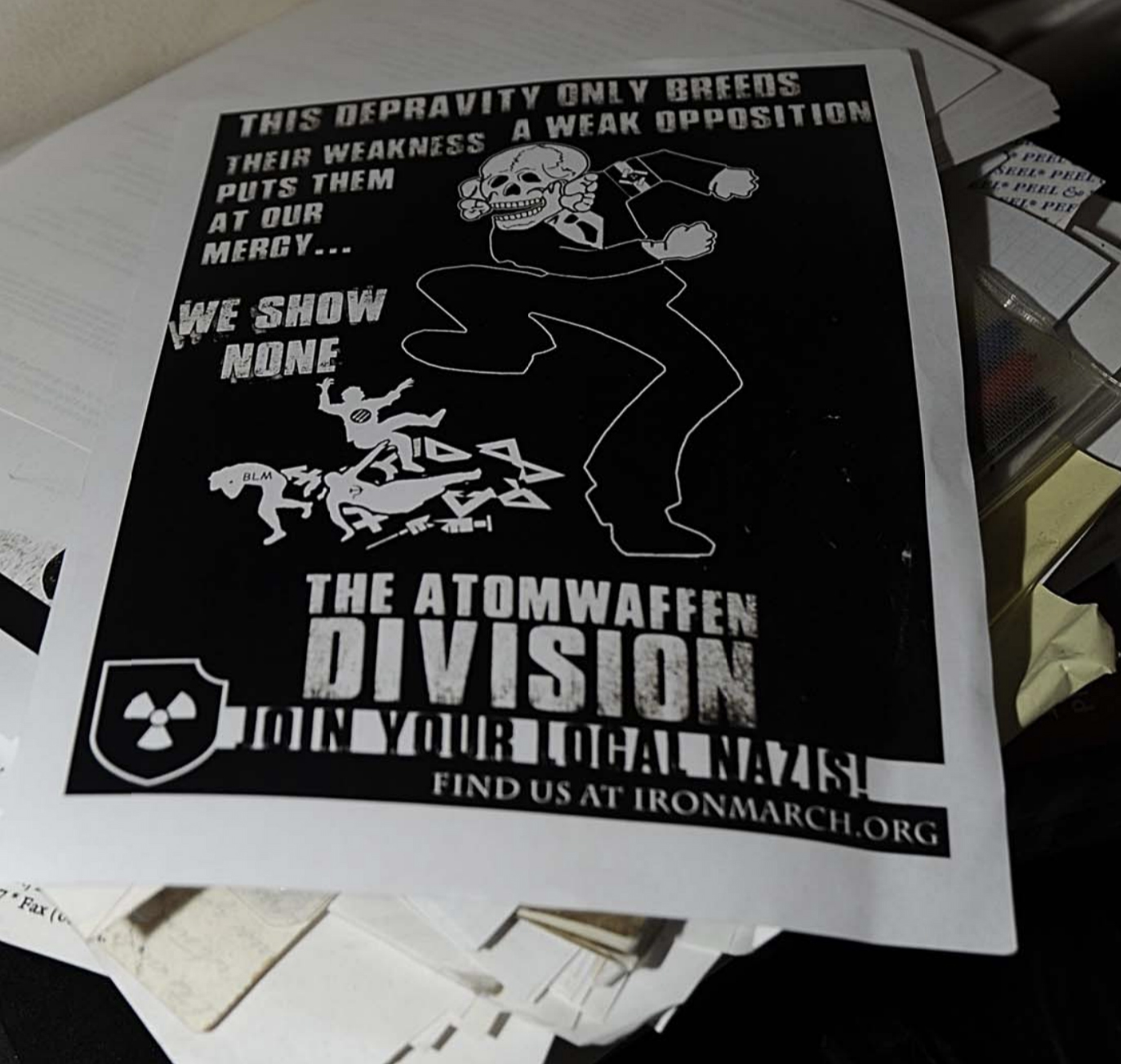 A flyer from Atomwaffen Division that was found during a search of Jeffrey and Edward Clark's house.