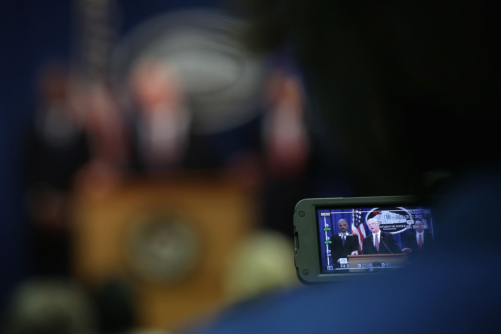 David Hickton, former U.S. Attorney for the Western District of Pennsylvania, speaks during a 2014 announcement of indictments against Chinese military hackers, with former Attorney General Eric Holder and former Assistant Attorney General for National Security John Carlin.