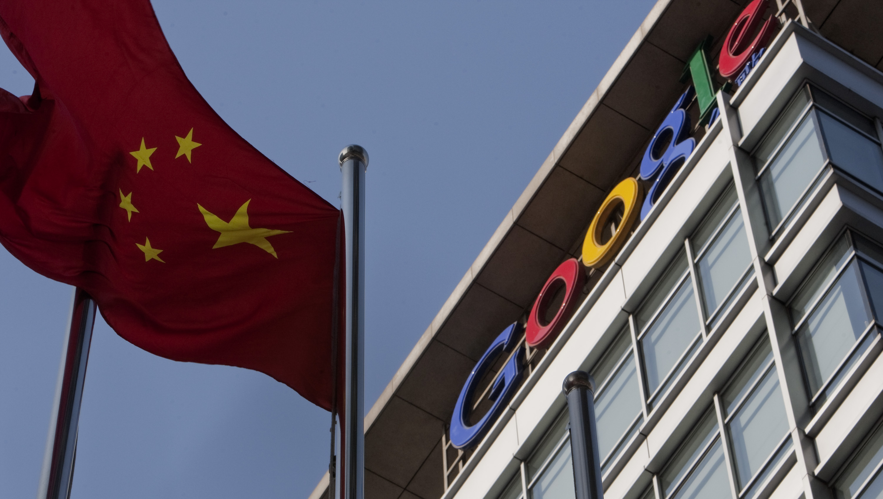 The Chinese flag flies outside the Google Inc. office in Beijing, China, on Thursday, Jan. 14, 2010.