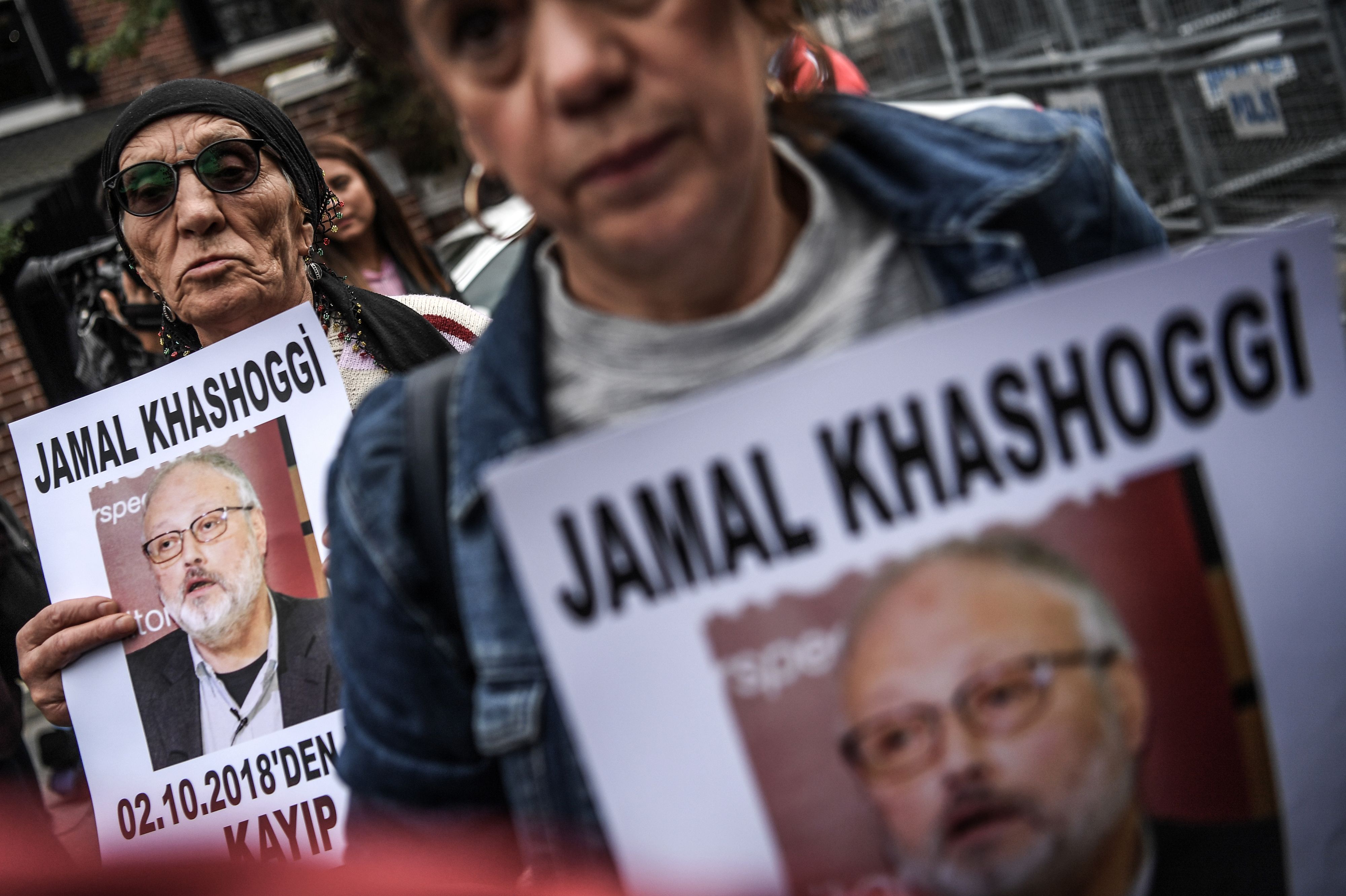 Protesters hold a portrait of Jamal Khashoggi reading "Jamal Khashoggi is missing since October 2."