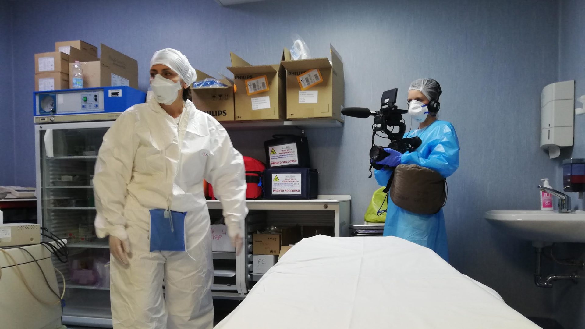 FRONTLINE producer Sasha Achilli films at a hospital that's treating an influx of COVID-19 patients in hard-hit Cremona, Italy.