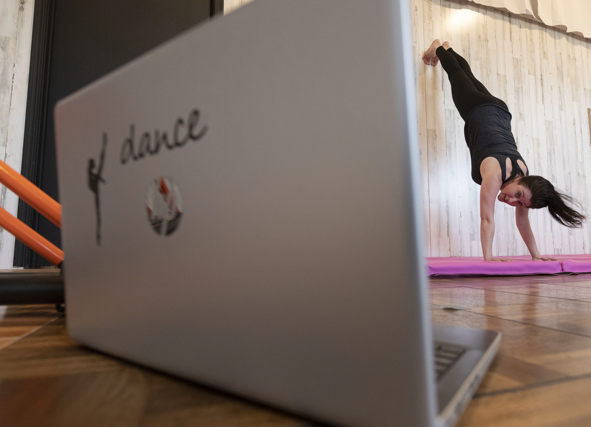 Holly Rohde teaches an acrobatic dance class via Zoom at her recently opened dance studio, Uplifting Movement and Fitness, Thursday, May 7, 2020 in Loyal, Wis. Rohde opened her business a week before the state-ordered shutdown. Since then she has been teaching some classes online in the studio she created from a defunct gas station.