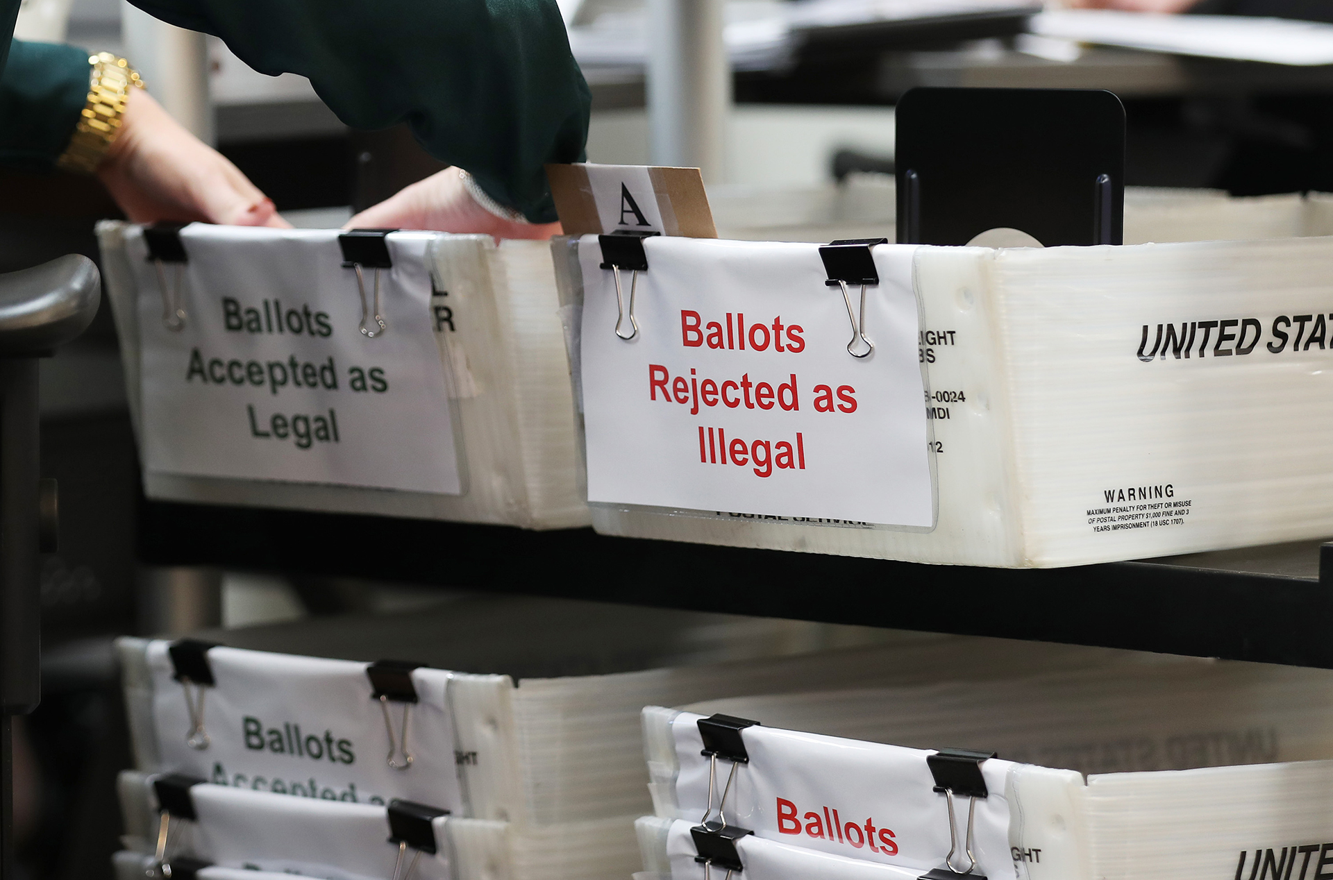 Vote-by-mail ballots received by the Miami-Dade County Elections Department had been sorted into accepted and rejected piles due to signature discrepancies on October 15, 2020. A new investigation finds that concerns about widespread absentee ballot fraud in the 2020 presidential election are unfounded.