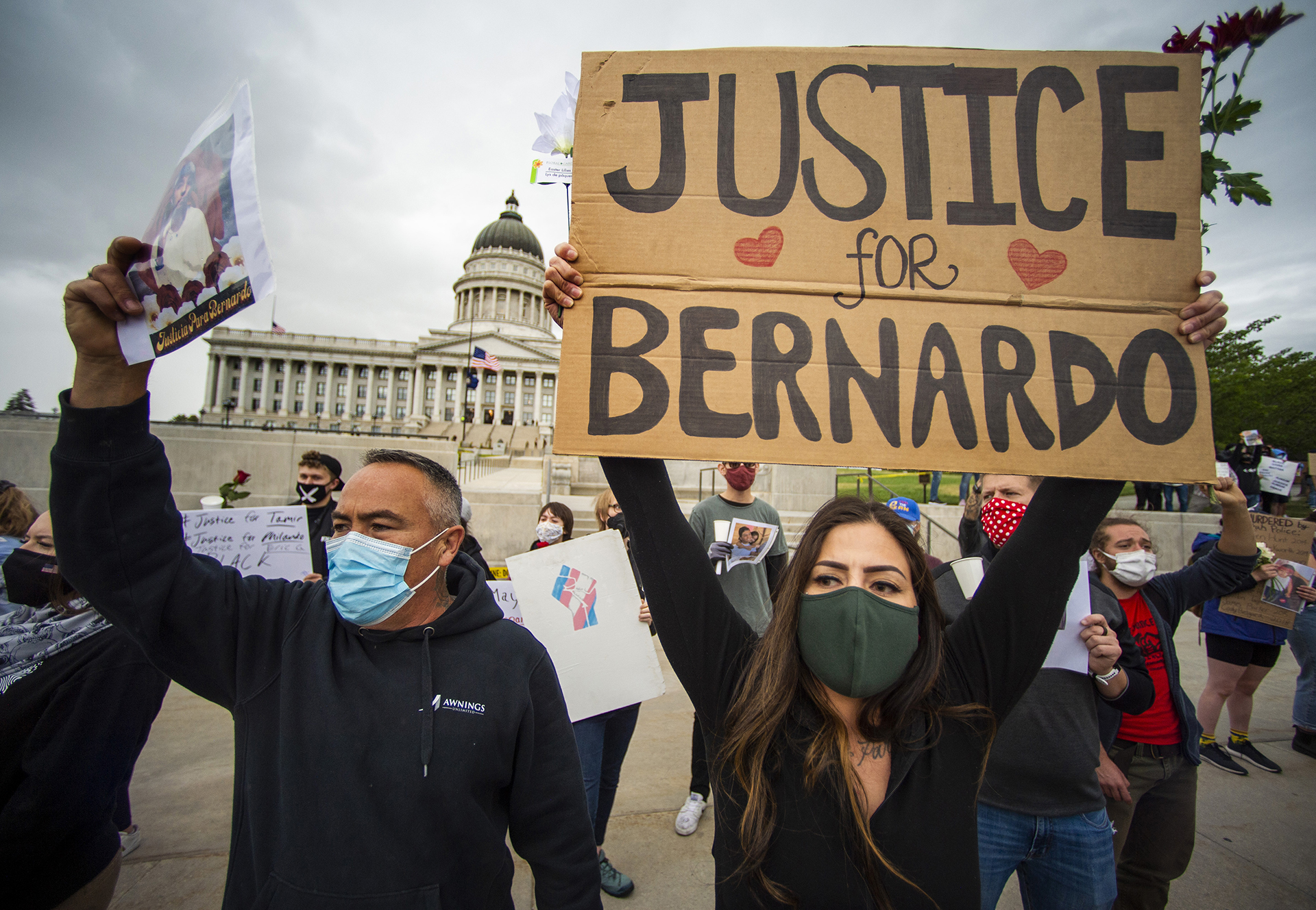 Mario Martinez and Alexandria Romero chant with the crowd as hundreds gather for a vigil for Bernardo Palacios-Carbajal at the State Capitol, on Saturday, June 6, 2020.