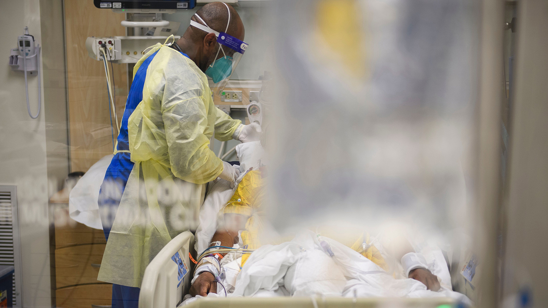 Nurses attend to patients in a COVID-19 intensive care unit on Jan. 6, 2021, at a hospital in Los Angeles.