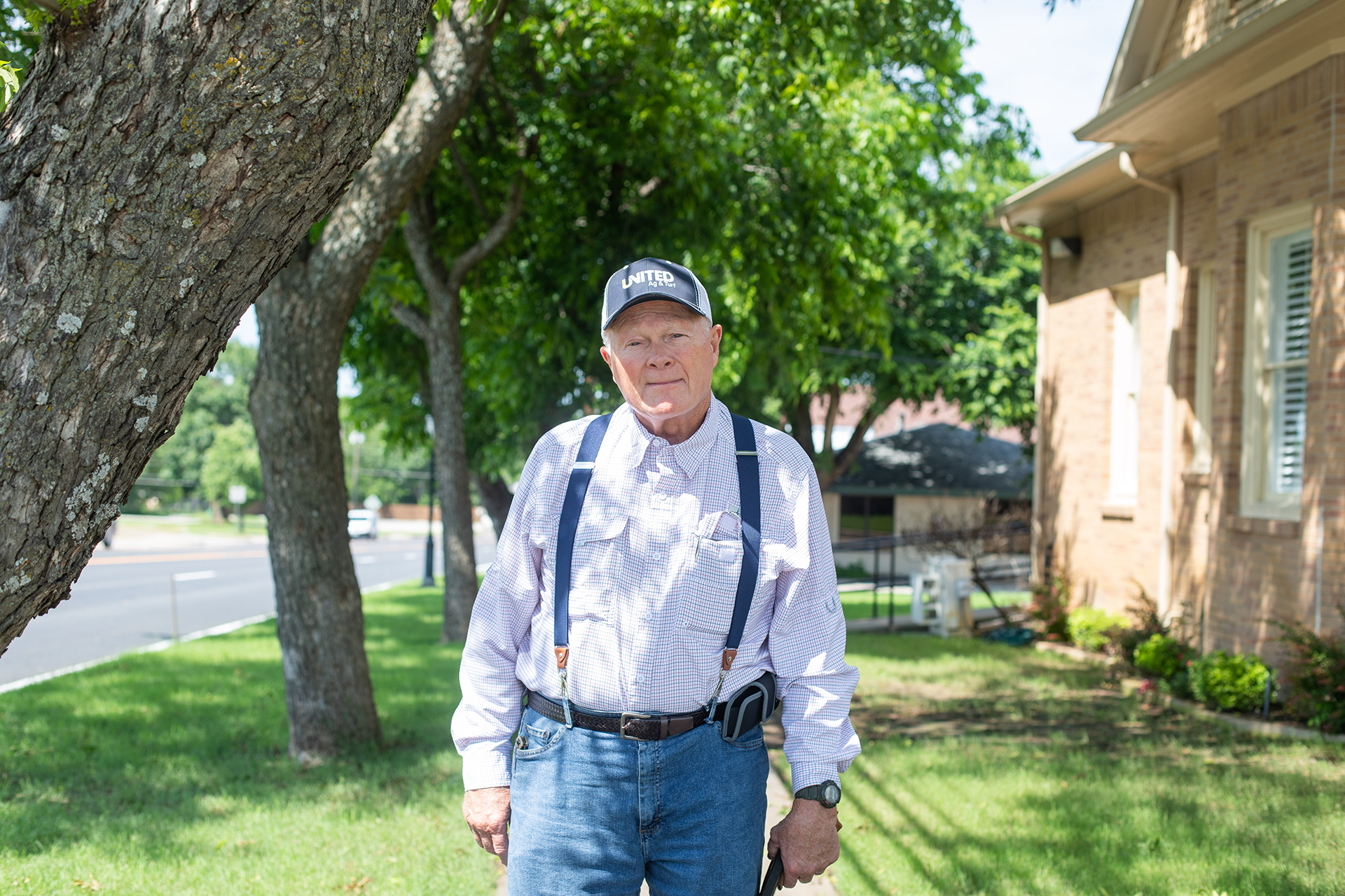 Lynn Heller, a former hospital administrator of the Bowie Memorial Hospital, poses for a portrait in Bowie, TX, on the same street he worked at for many years before retiring.