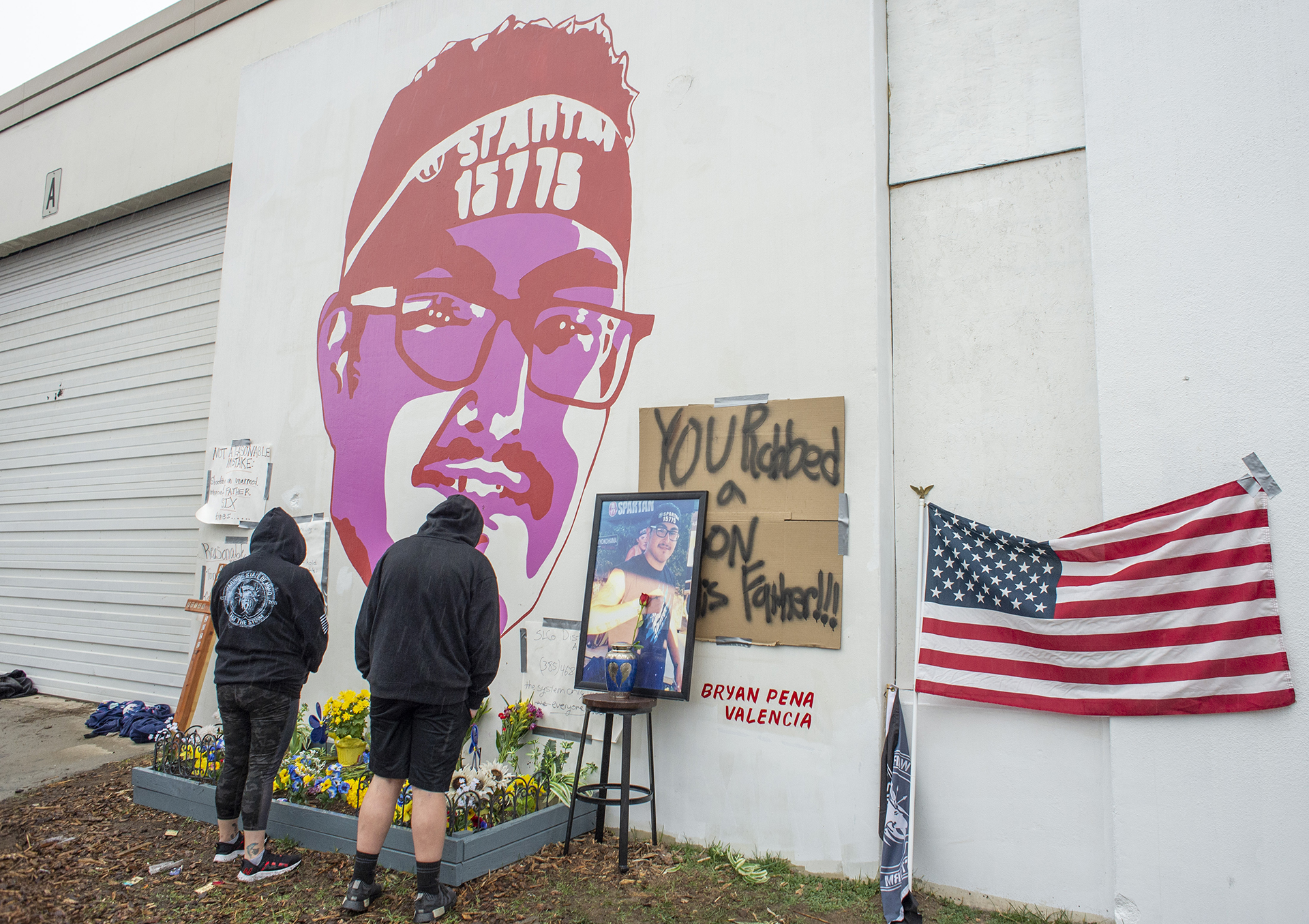 Olivia Herrera and Luciano Pena-Valencia, Bryan's son, check out the memorial for Bryan Pena-Valencia on Saturday, March 20, 2021.