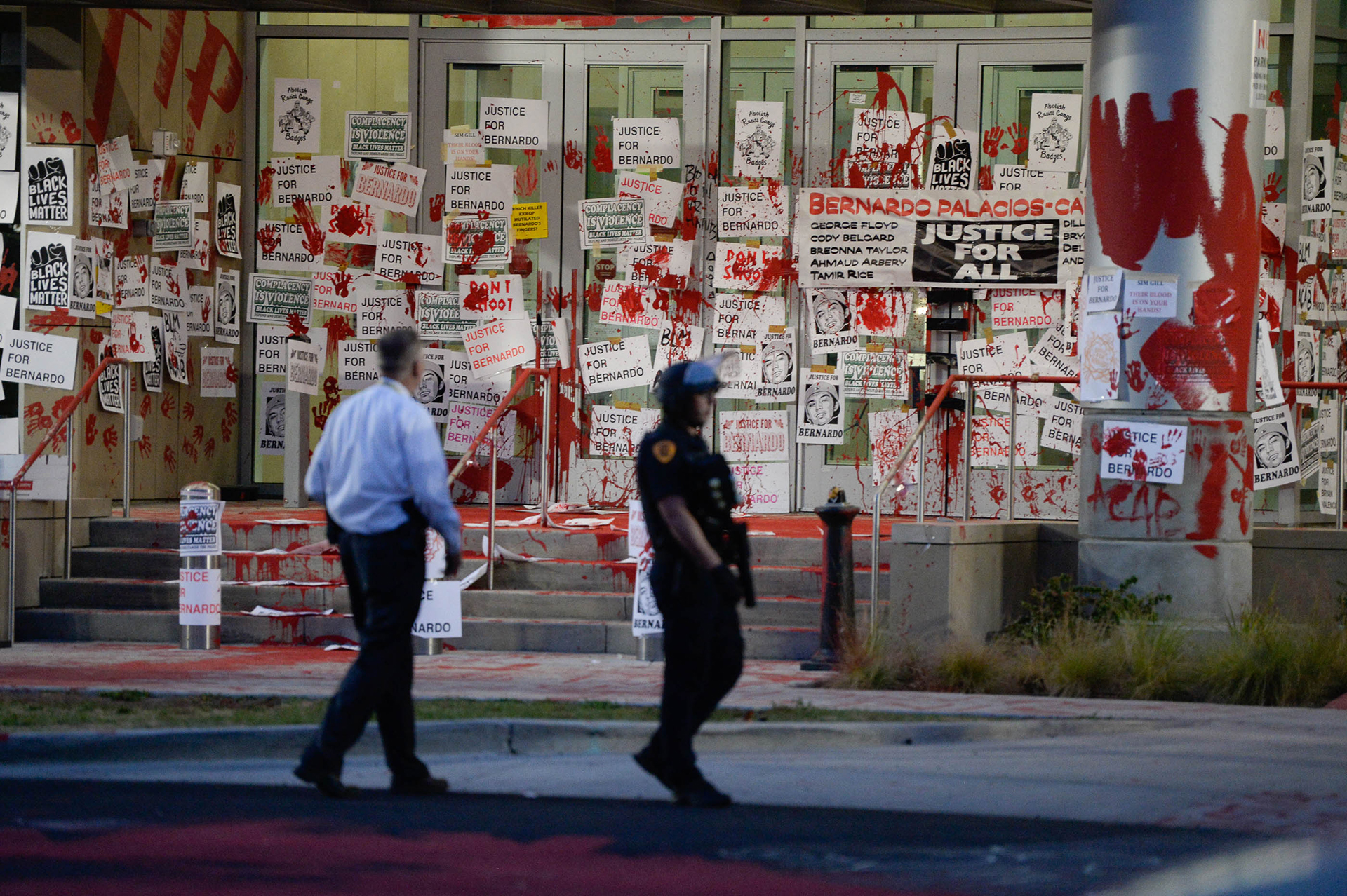 (Francisco Kjolseth  |  The Salt Lake Tribune) Jim Winder, left, chief of investigations at the Salt Lake County District Attorney’s Office, overlooks the damage to the building after protesters reacted to the announced ruling by Salt Lake County District Attorney Sim Gill on Thursday, July 9, 2020, that the shooting death of 22-year-old Bernardo Palacios-Carbajal in May by police officers was legally justified.