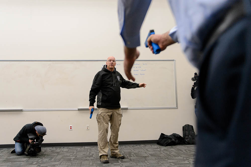 (Trent Nelson | The Salt Lake Tribune)  Salt Lake City police Sgt. Mike Burbank plays the role of an armed suspect during a demonstration on use of force and arrest tactics in Salt Lake City, Tuesday December 5, 2017.