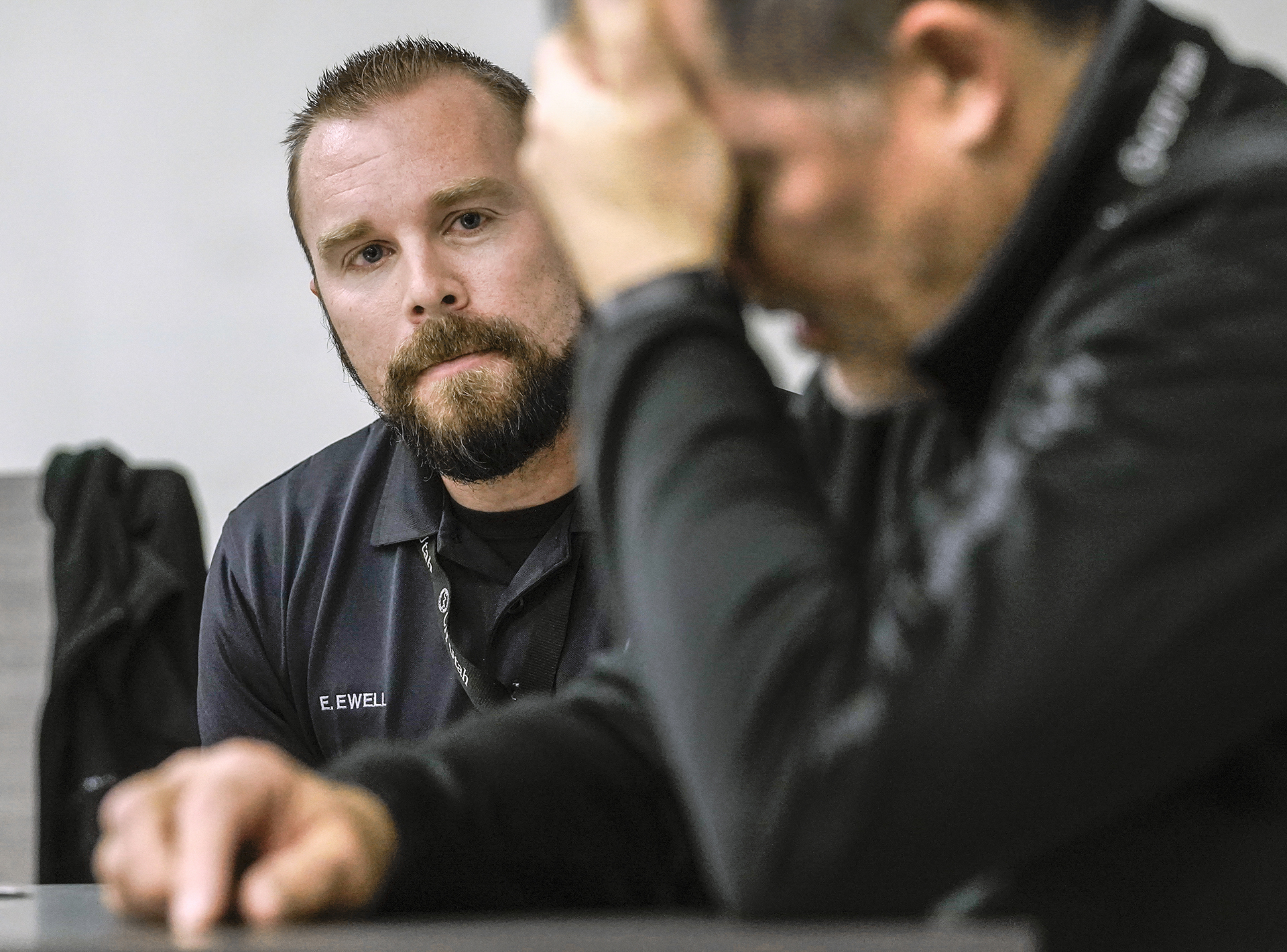 Eric Ewell with the Layton Police Department, left, role plays with CIT instructor and clinical psychologist Dr. Todd Soutor who plays the role of someone with schizophrenia. Police officers from multiple agencies attend Crisis Intervention Team training or CIT at the Layton Police Department, Nov. 4, 2021.  The officers role play various scenarios to strategize new crisis intervention responses in dealing with the public.