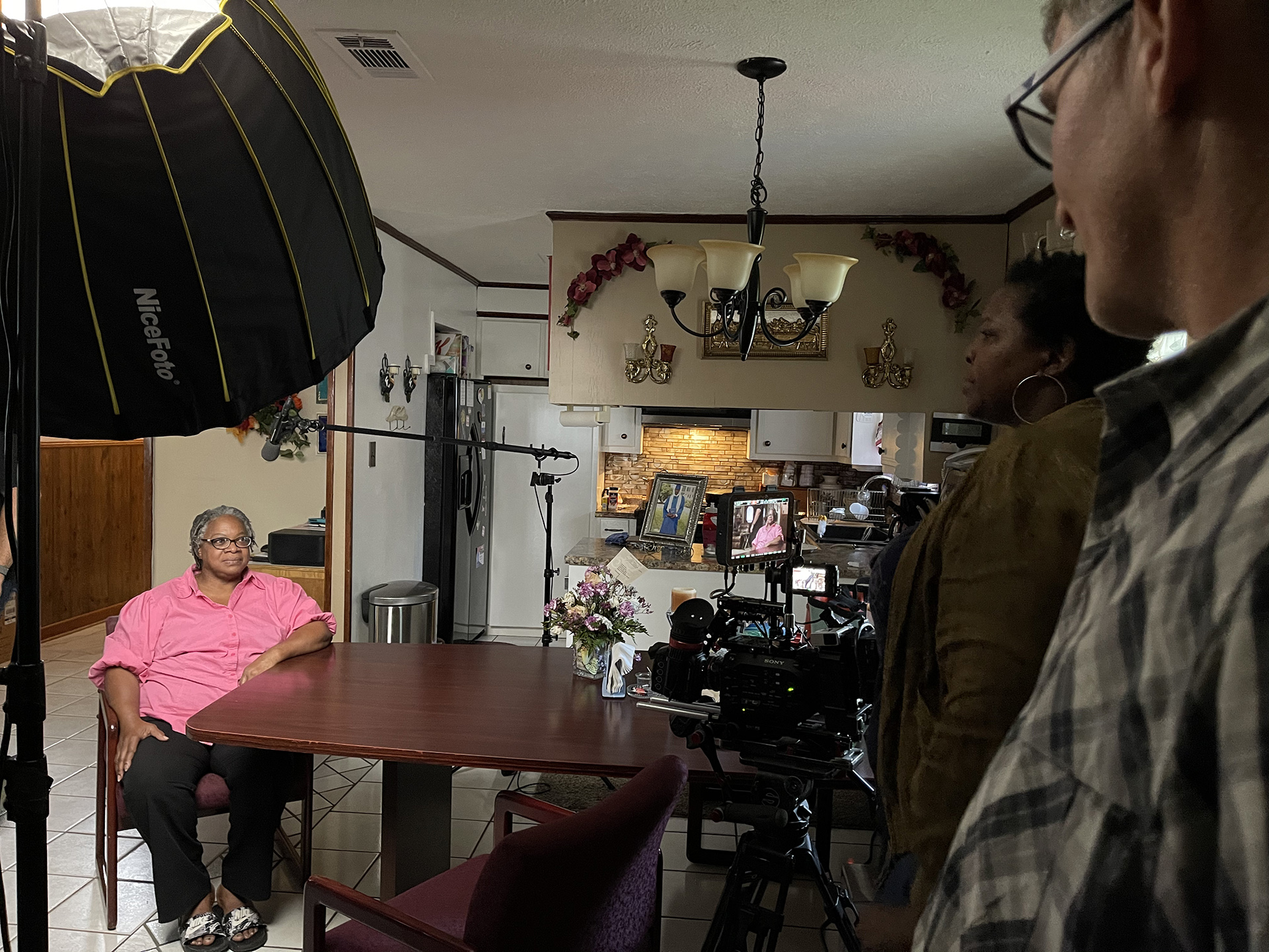 Directors Yoruba Richen (second from right) and Brad Lichtenstein (far right) interview Denise Jackson Ford during production of "American Reckoning."