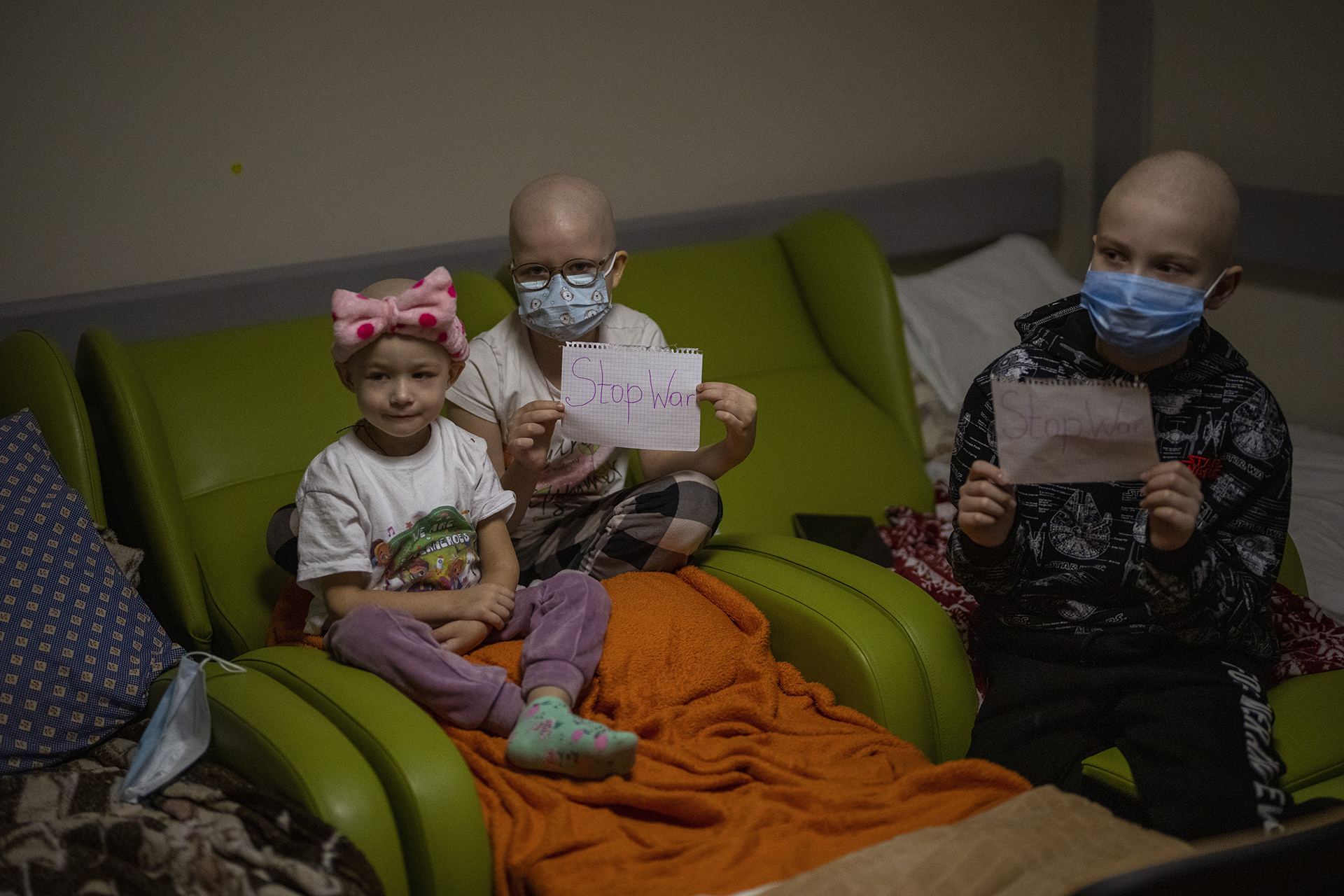 Pediatric oncology patients Stop War signs basement bomb shelter children's hospital Kyiv, Ukraine