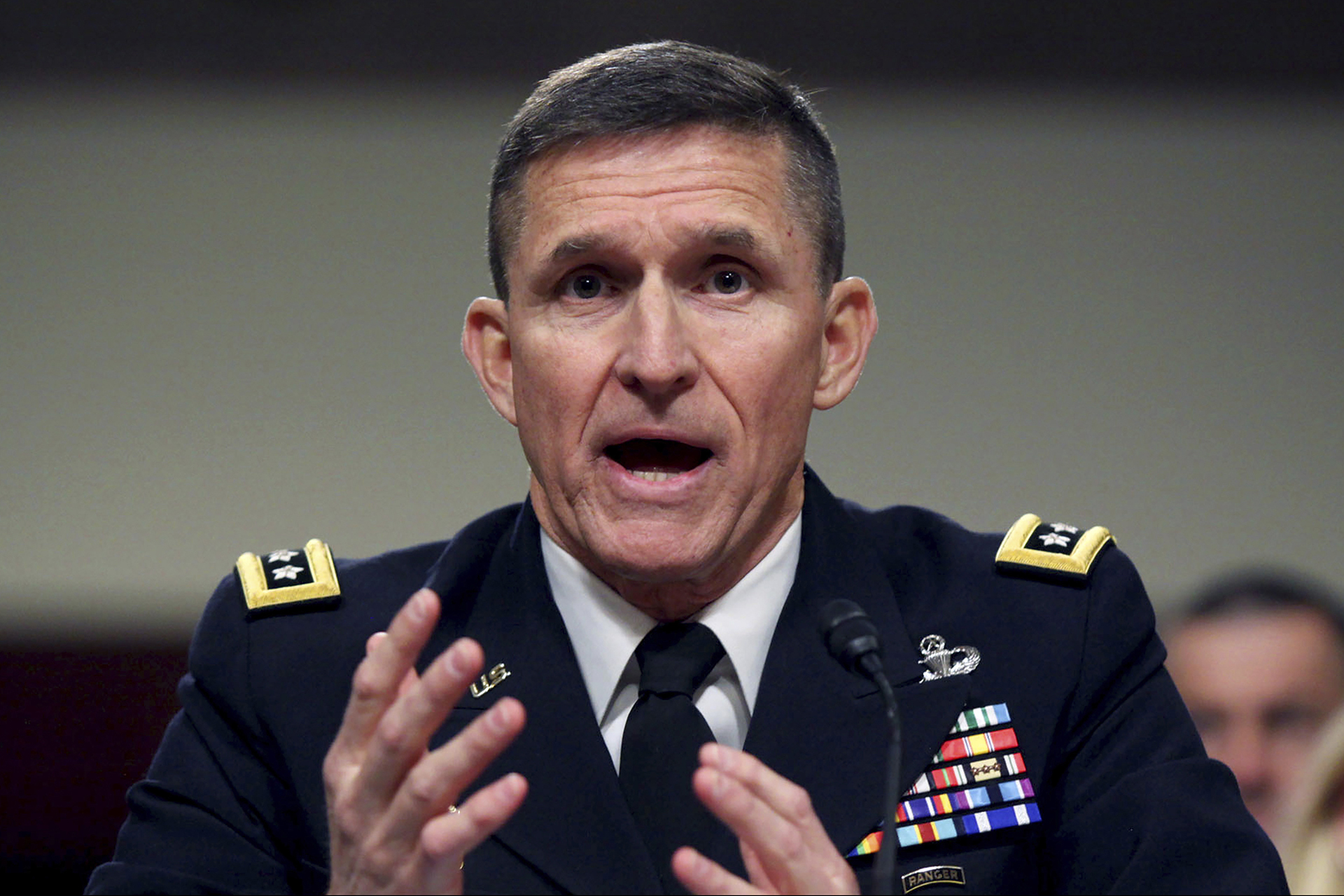 FILE - Defense Intelligence Agency Director Lt. Gen. Michael Flynn testifies on Capitol Hill on Feb. 11, 2014, in Washington. Once a respected anti-terrorism warrior, the retired lieutenant general is now a fount of conspiracy theories, among them that Donald Trump was robbed of victory in 2020.