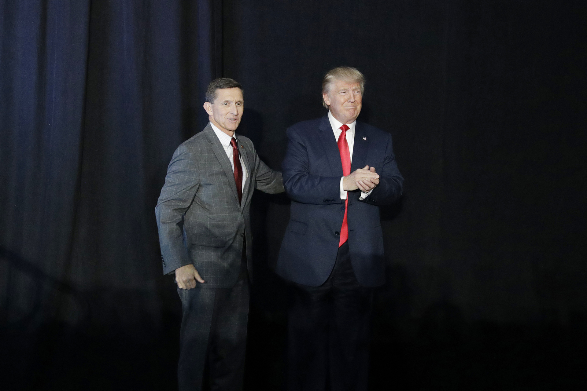 FILE - Retired Lt. Gen. Michael Flynn, left, introduces Republican presidential candidate Donald Trump at a campaign rally on Sept. 29, 2016, in Bedford, N.H. Flynn became a chief promoter of the so-called “Stop the Steal” effort and championed bogus claims about foreign interference and ballot tampering that weren’t supported by credible evidence.