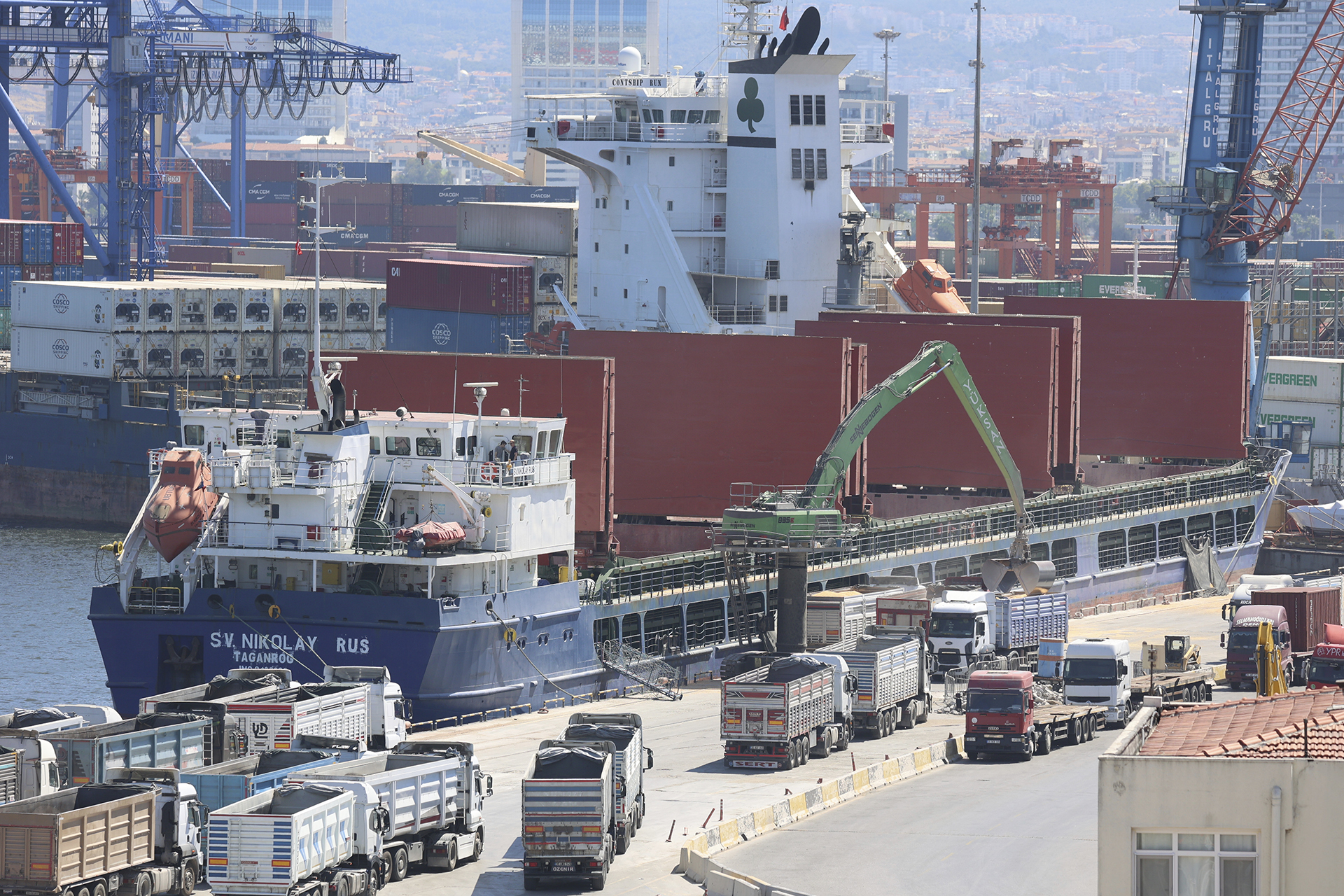 Grain is unloaded from the cargo ship SV. Nikolay docked in Izmir, Turkey, on June 25, 2022. The grain, which satellite imagery shows was loaded at the Russian-occupied Ukrainian port of Sevastopol, Crimea, was purchased by the Turkish food company Yayla Agro. A spokesman for the company said it had been provided documents stating the cargo had come from the small Russian port of Kavkaz, more than 160 miles (257 kilometers) to the east of Sevastopol. (AP Photo/Yoruk Isik)