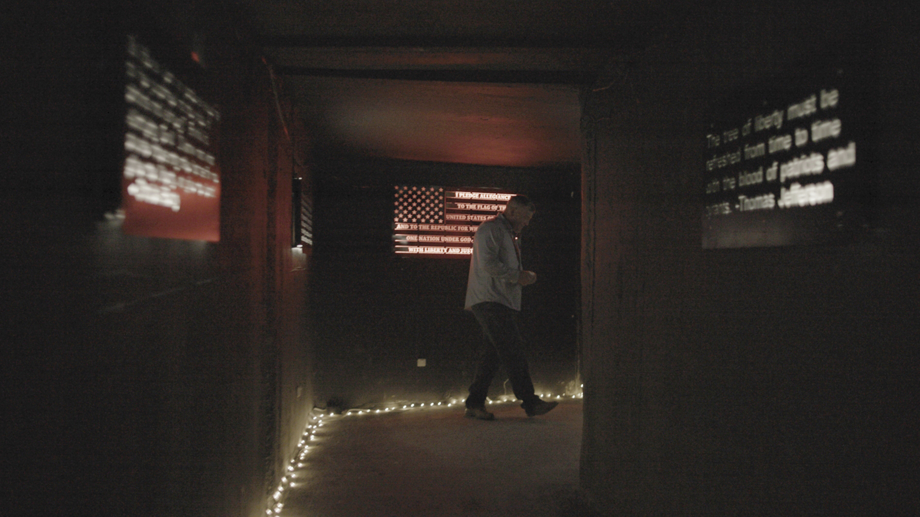 Owner Victor Mellor, Sr., walks through an entrance hallway at The Hollow in Venice, Fla., on Aug. 1, 2022. Mellor said members of the violent extremist group the Proud Boys had volunteered at the Hollow before he knew they were members of the group, but said they were welcome, calling them “just dads and husbands.”