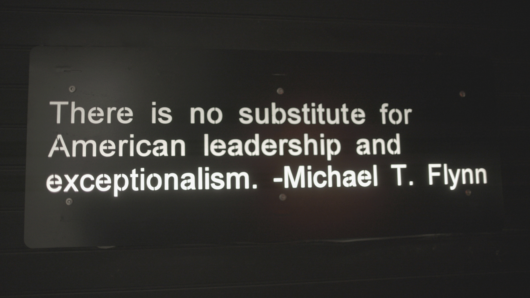 A quote from Michael Flynn, a retired three-star general who served as Donald Trump's national security advisor, is displayed in an entrance hallway at The Hollow in Venice, Fla., on July 31, 2022.