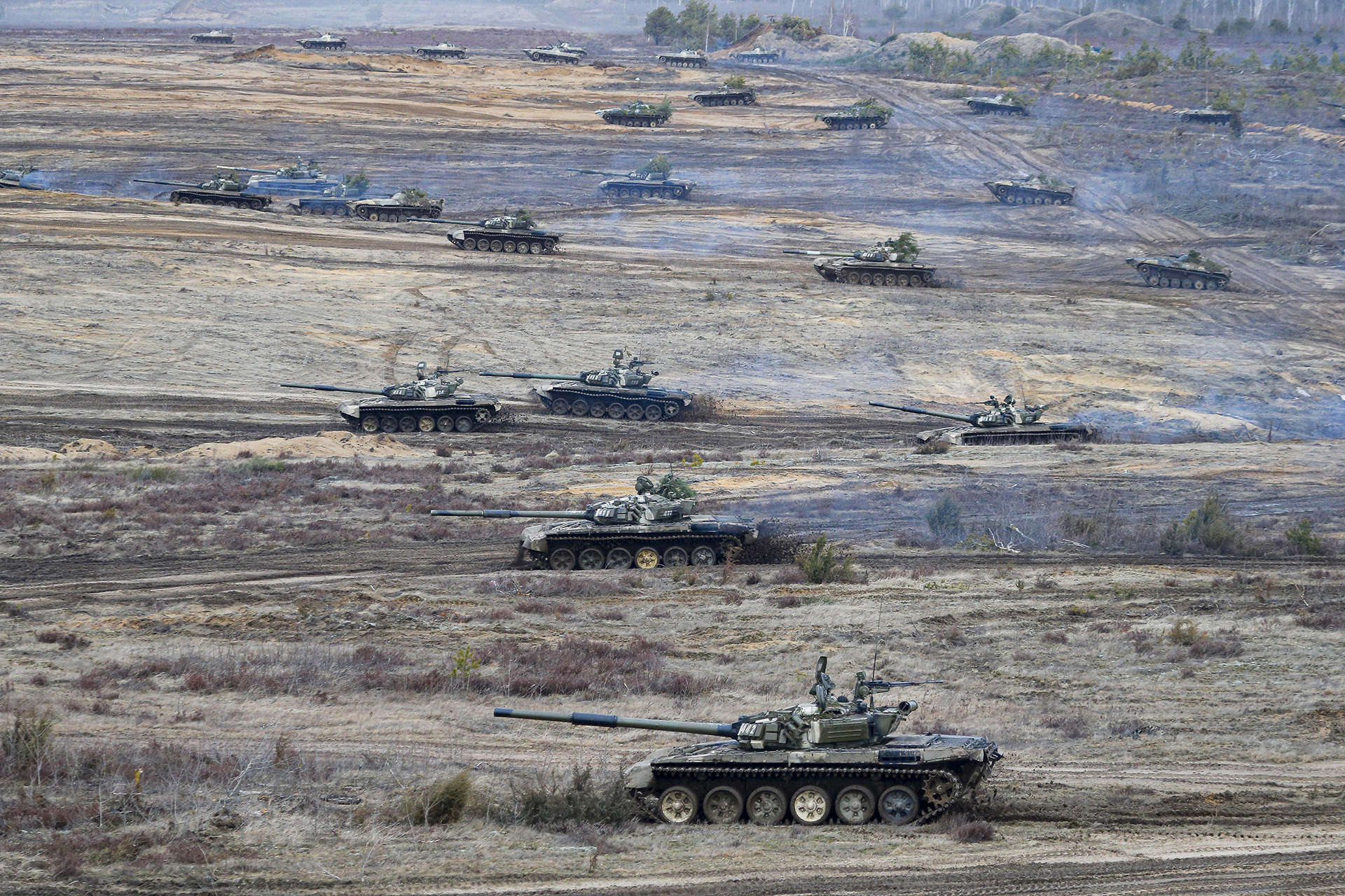 Tanks participate in the Union Courage-2022 Russia-Belarus military drills at the Obuz-Lesnovsky training ground in Belarus, Saturday, Feb. 19, 2022. (AP Photo/Alexander Zemlianichenko Jr., File)