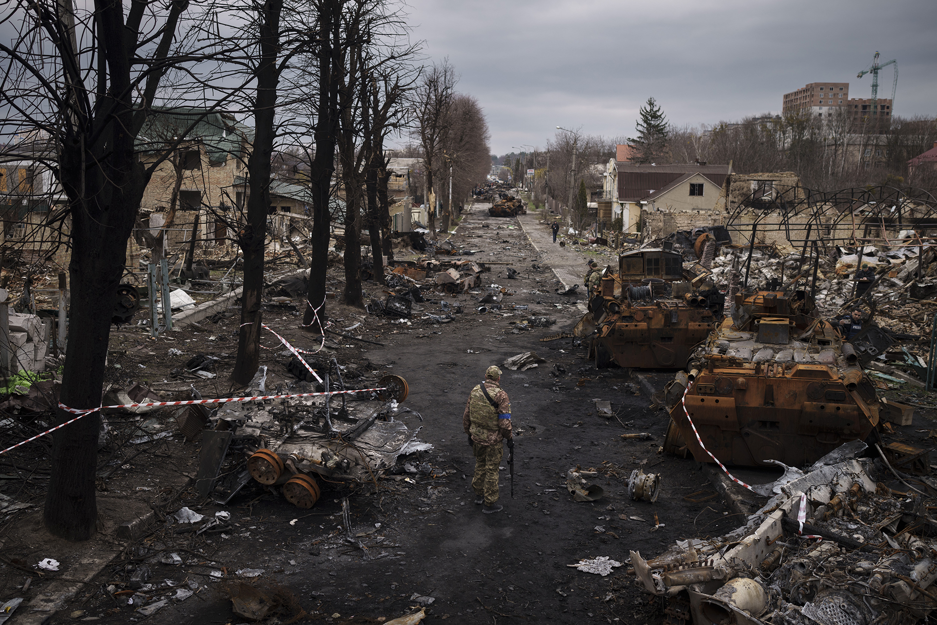 FILE - A Ukrainian serviceman walks amid destroyed Russian tanks in Bucha, Ukraine, on the outskirts of Kyiv, Wednesday, April 6, 2022. (AP Photo/Felipe Dana, File)
