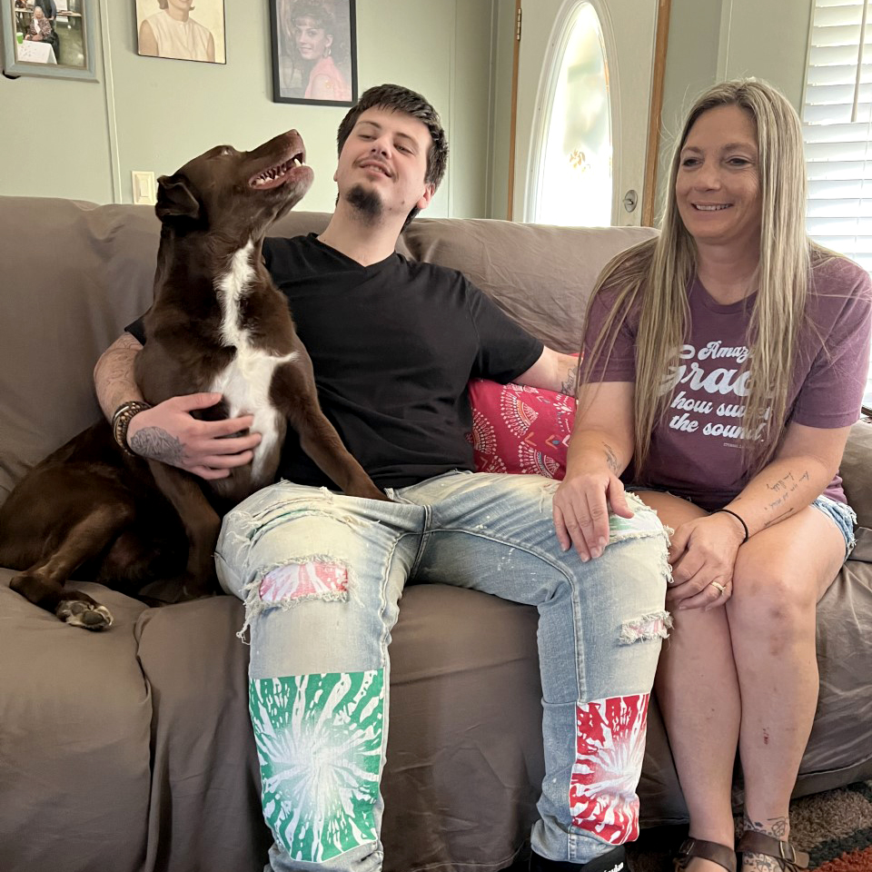 Anthony Muckenfuss (left) with his dog and mother, Angel Chavis (right).