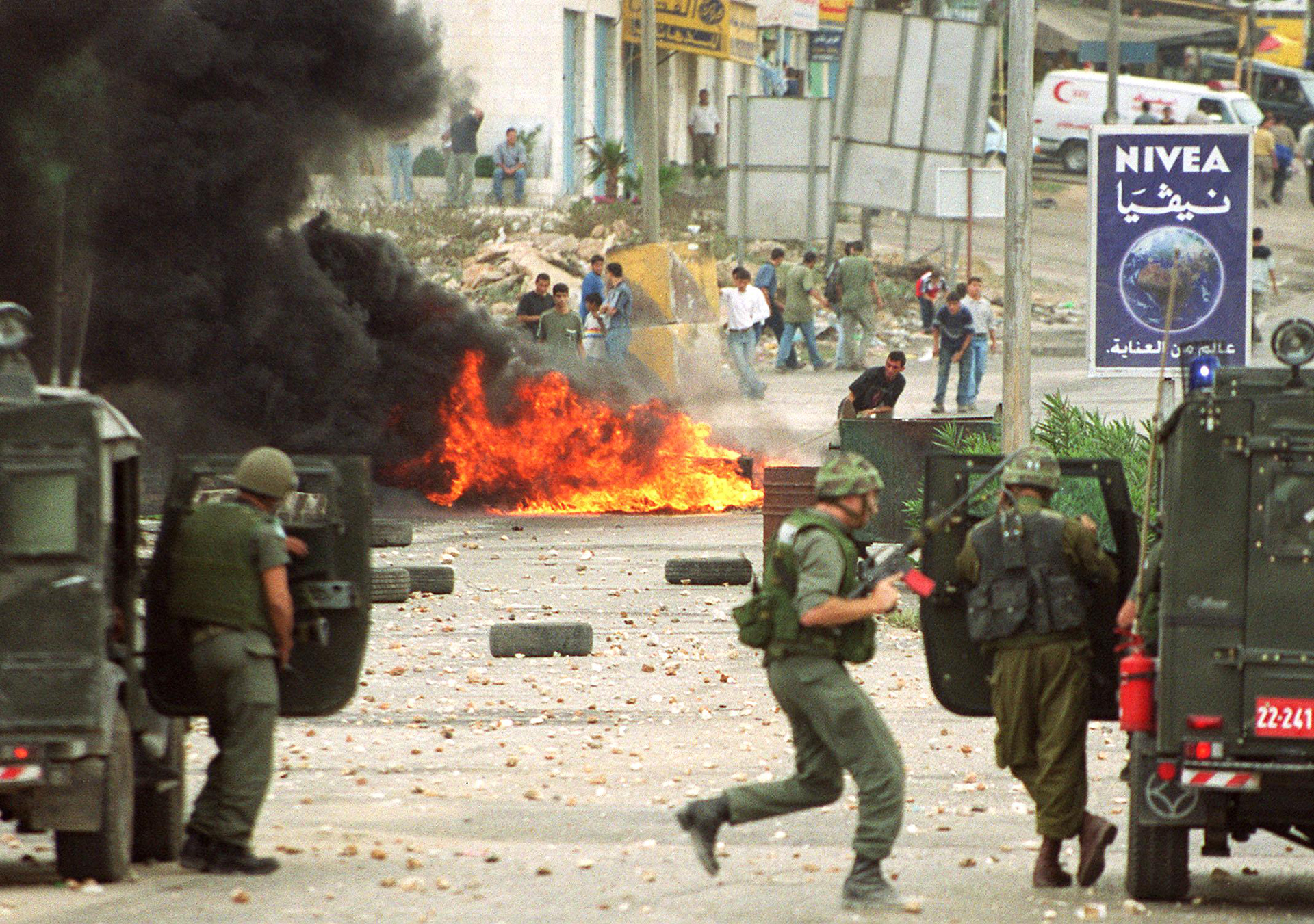 Israeli soldiers and Palestinian youths clash in Ramallah on Sept. 28, 2000.