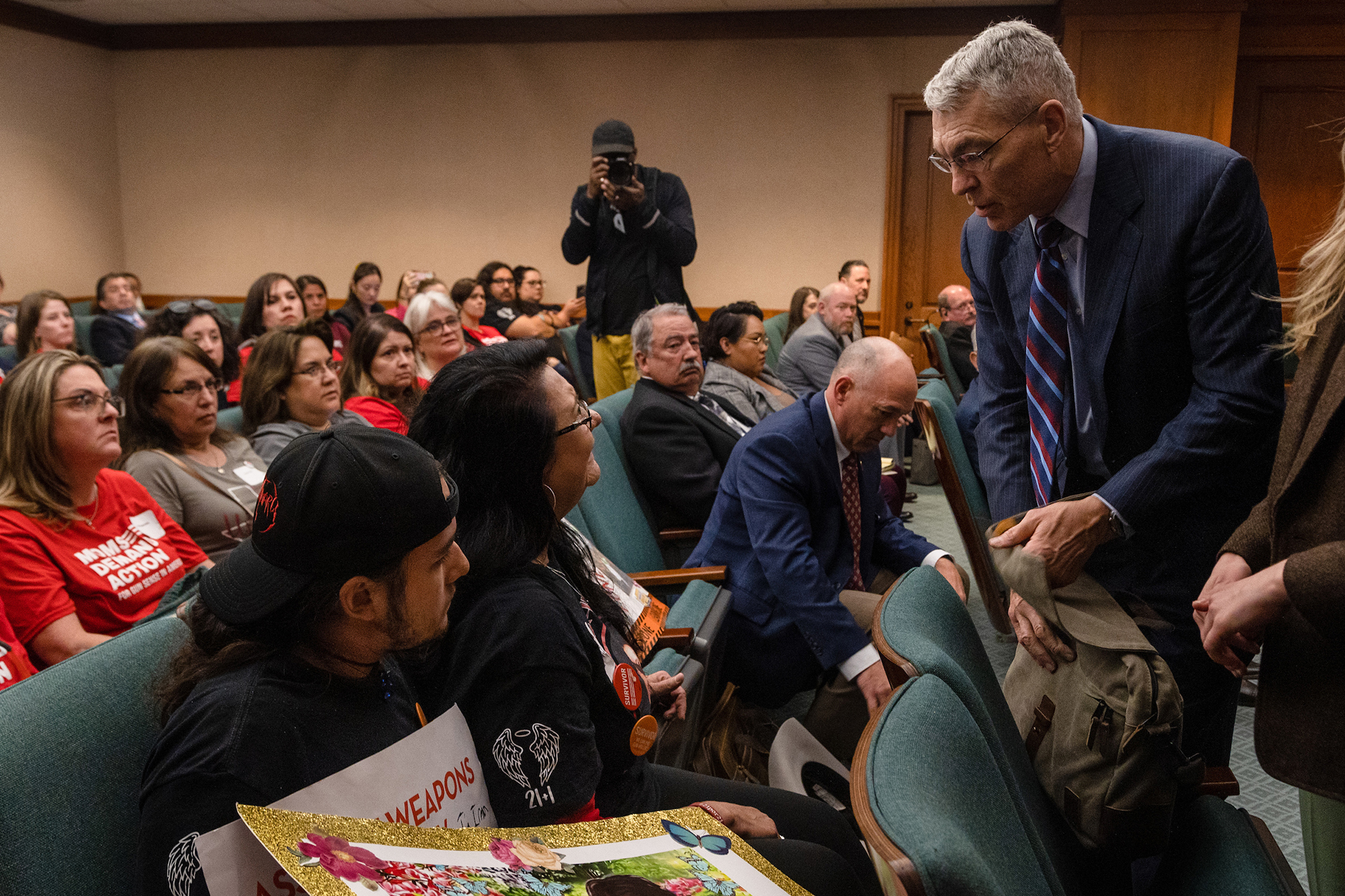 Velma Duran, the sister of Irma Garcia, one of the two teachers killed in the Robb Elementary school shooting, confronts Texas Department of Public Safety Director Steve McCraw after he finished testifying to the Homeland Security & Public Safety committee hearing at the state Capitol in Austin on Feb. 28, 2023. “They stood around and enabled the shooter to obliterate my sister. You couldn’t recognize her,” Duran said to McCraw. “Look at me!”