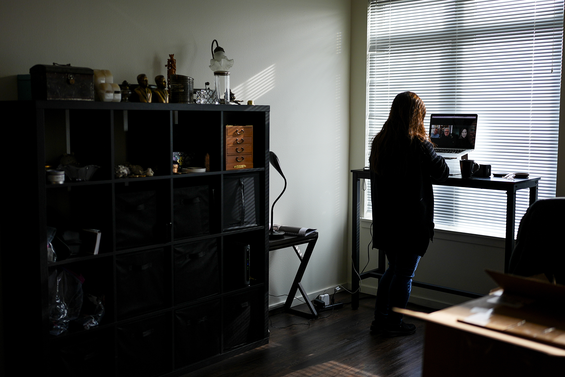 Rebecca Kimmel talks with her adoptive parents on her laptop at her home Saturday, Feb. 3, 2024, in Seattle. Her adoptive parents have also struggled with their unintended role in a deeply flawed system. Thousands of South Korean adoptees are looking to satisfy a raw, compelling urge that much of the world takes for granted: the search for identity. (AP Photo/Lindsey Wasson)