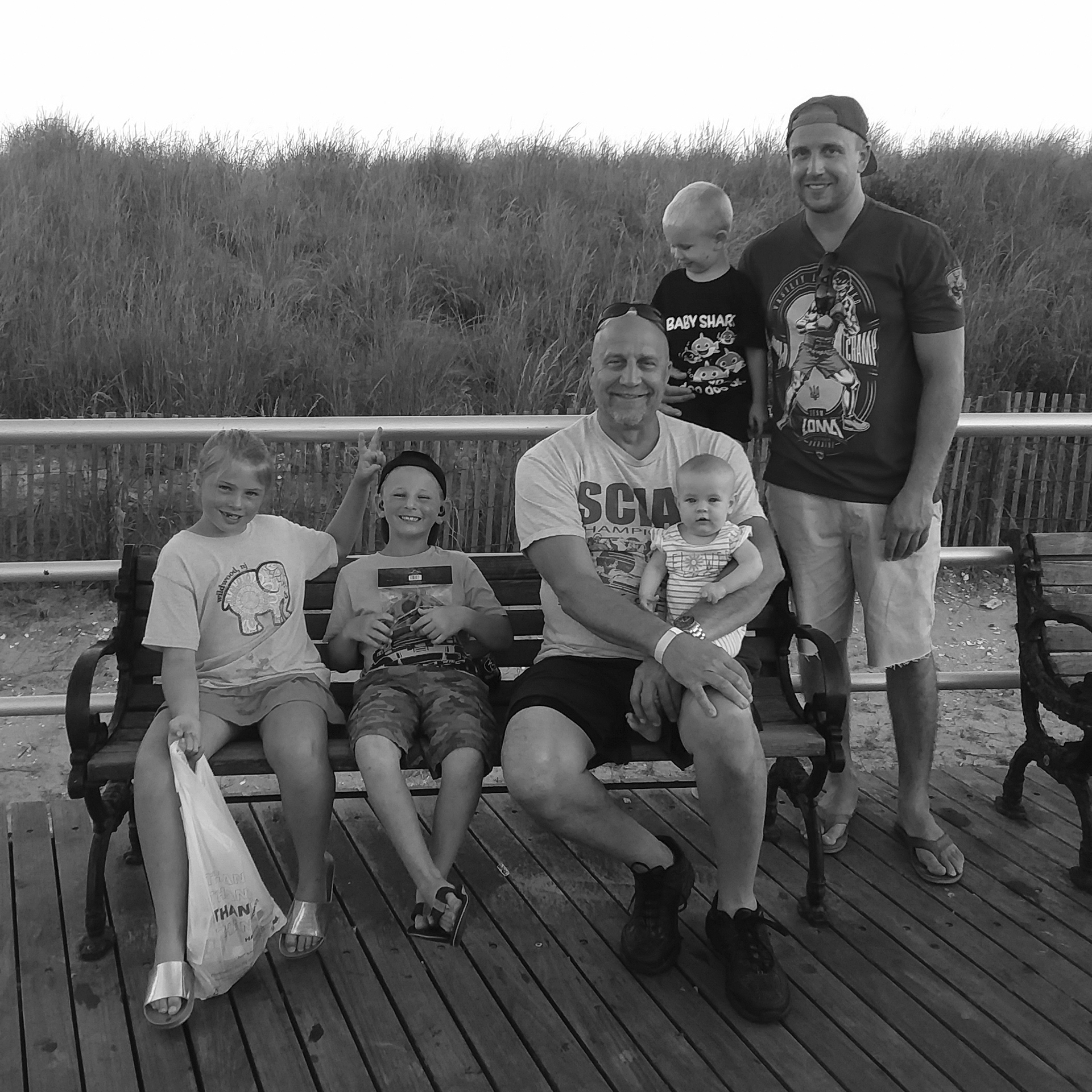 This photo provided by the family shows Edward Snukis, center, with four of his grandchildren and his son, Ed Snukis Jr., during a trip to Atlantic City, N.J., on Sept. 3, 2019. Snukis died later in the month after police officers in Evansville, Ind., shocked him with a Taser, punched him and held him face down. (Jill Snukis via AP)