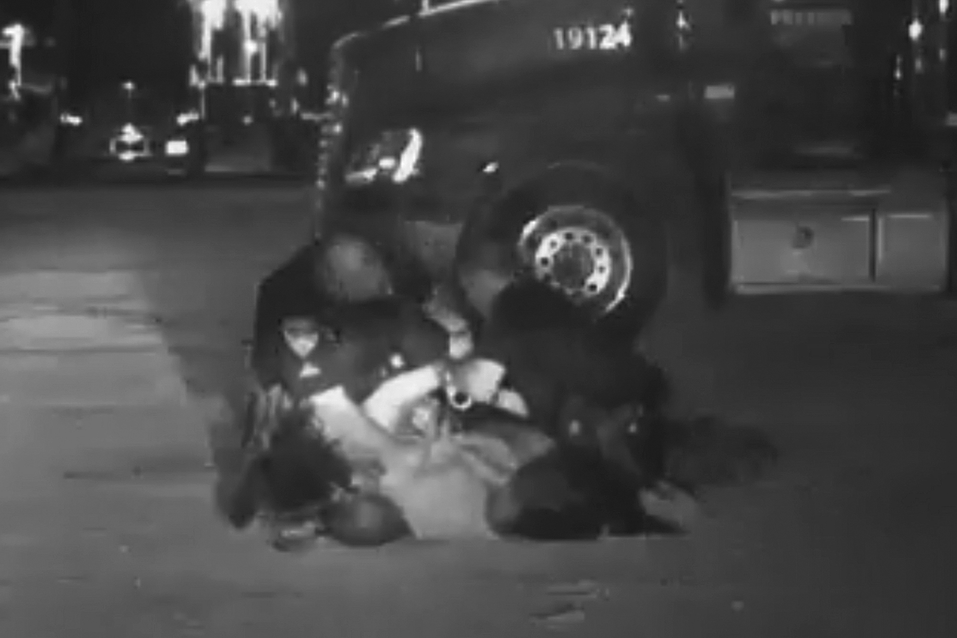 In this image from video provided by the Evansville Police Department, Edward Snukis, bottom center, is restrained by officers in Evansville, Ind., on Sept. 13, 2019. Snukis, 55, died after police officers shocked him with a Taser, punched him and held him face down. (Evansville Police Department via AP)