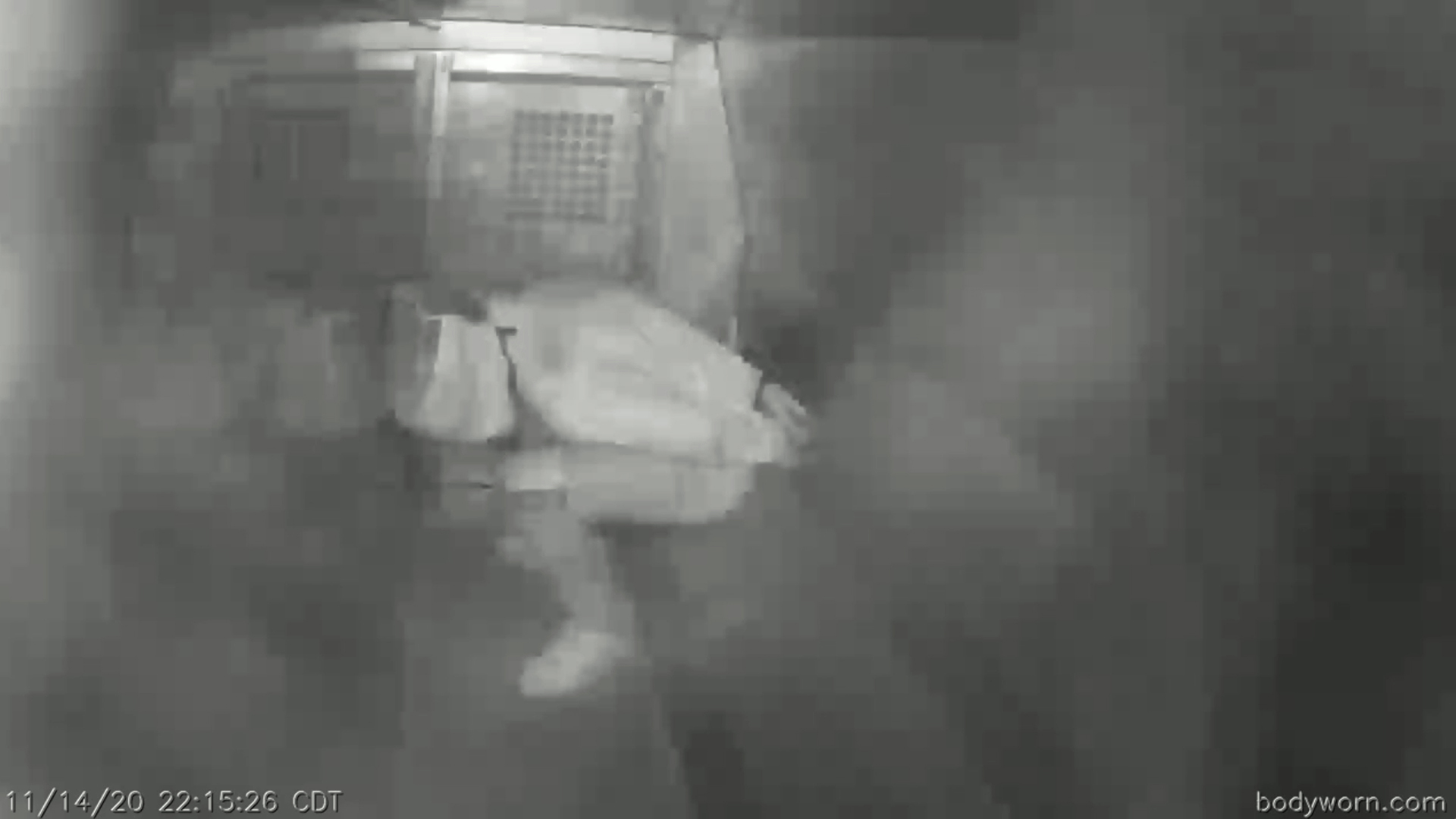 This image from Evansville Police Department video shows Evan Terhune, hands cuffed behind his back and his face covered by a spit hood, in the back of a police van in Evansville, Ind., on Nov. 14, 2020. By the time officers opened the van, he was unresponsive. (Evansville Police Department via AP)