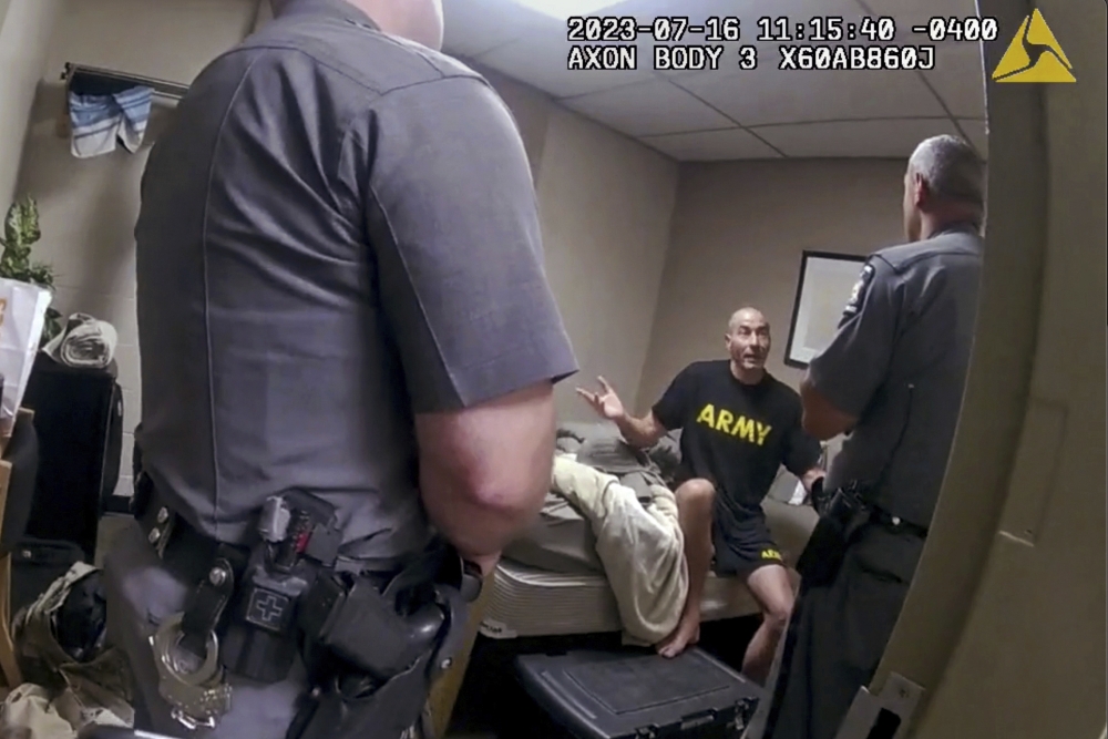 In this image taken from New York State Police body camera video, New York State Police interview Army reservist Robert Card at Camp Smith in July 2023 just before he was ordered to go to the hospital for an evaluation. Screenshot from New York State Police video