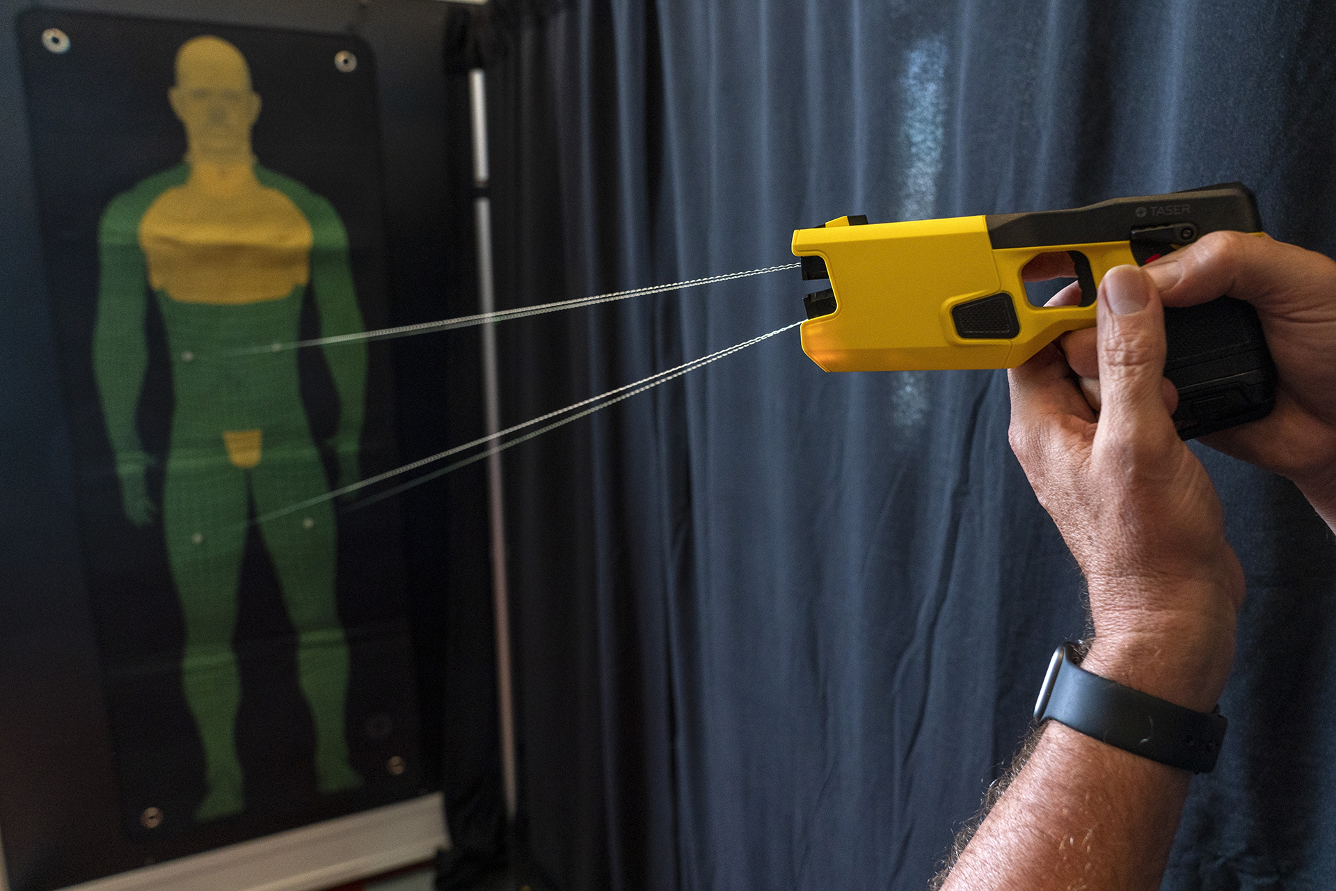 FILE - A representative for Axon Enterprise Inc. demonstrates the company's TASER 7 in Washington on Thursday, May 12, 2022. (AP Photo/Jacquelyn Martin, File)