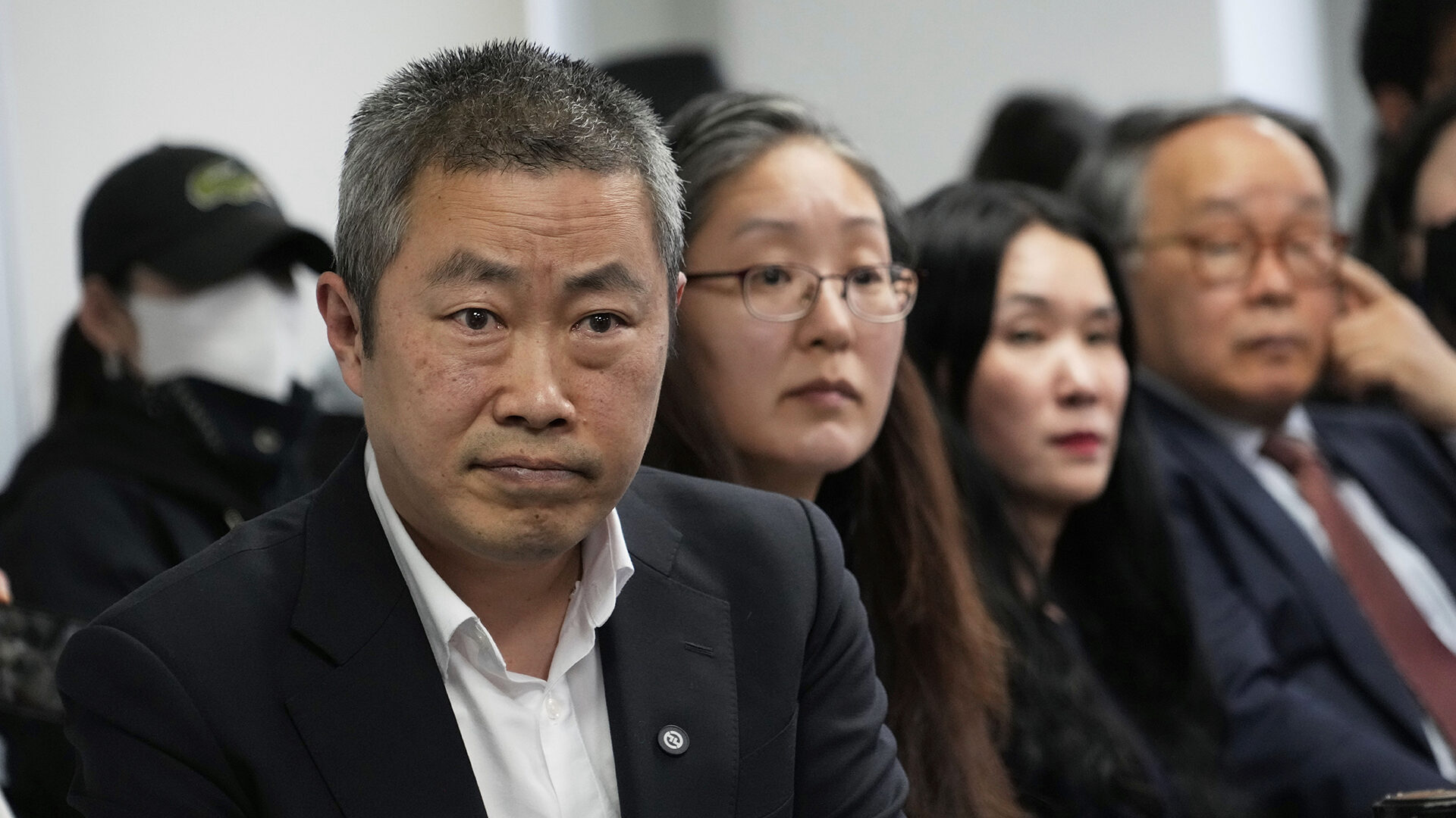 Peter Møller, left, Boonyoung Han, second from left, co-founders of the Danish Korea Rights Group, and adoptee Yooree Kim, second from right, attend a press conference at the Truth and Reconciliation Commission in Seoul, South Korea, on March 26, 2025.