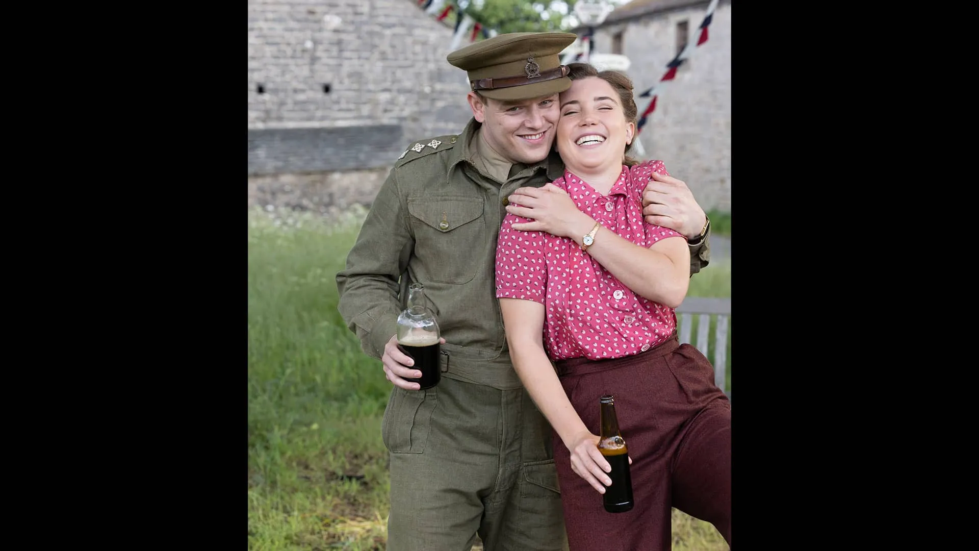 In a behind the scenes moment, Callum Woodhouse holds Gaia Woodhouse tight, smiling impishly as she is broken out in a big laugh.