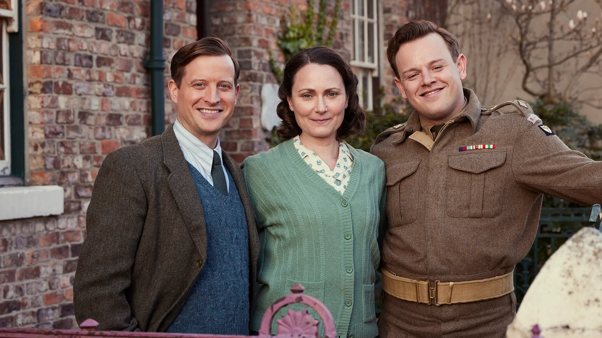 Nicholas Ralph as James Herriot, Anna Madeley as Mrs. Hall, and Callum Woodhouse as Tristan Farnon in All Creatures Great and Small Season 6.