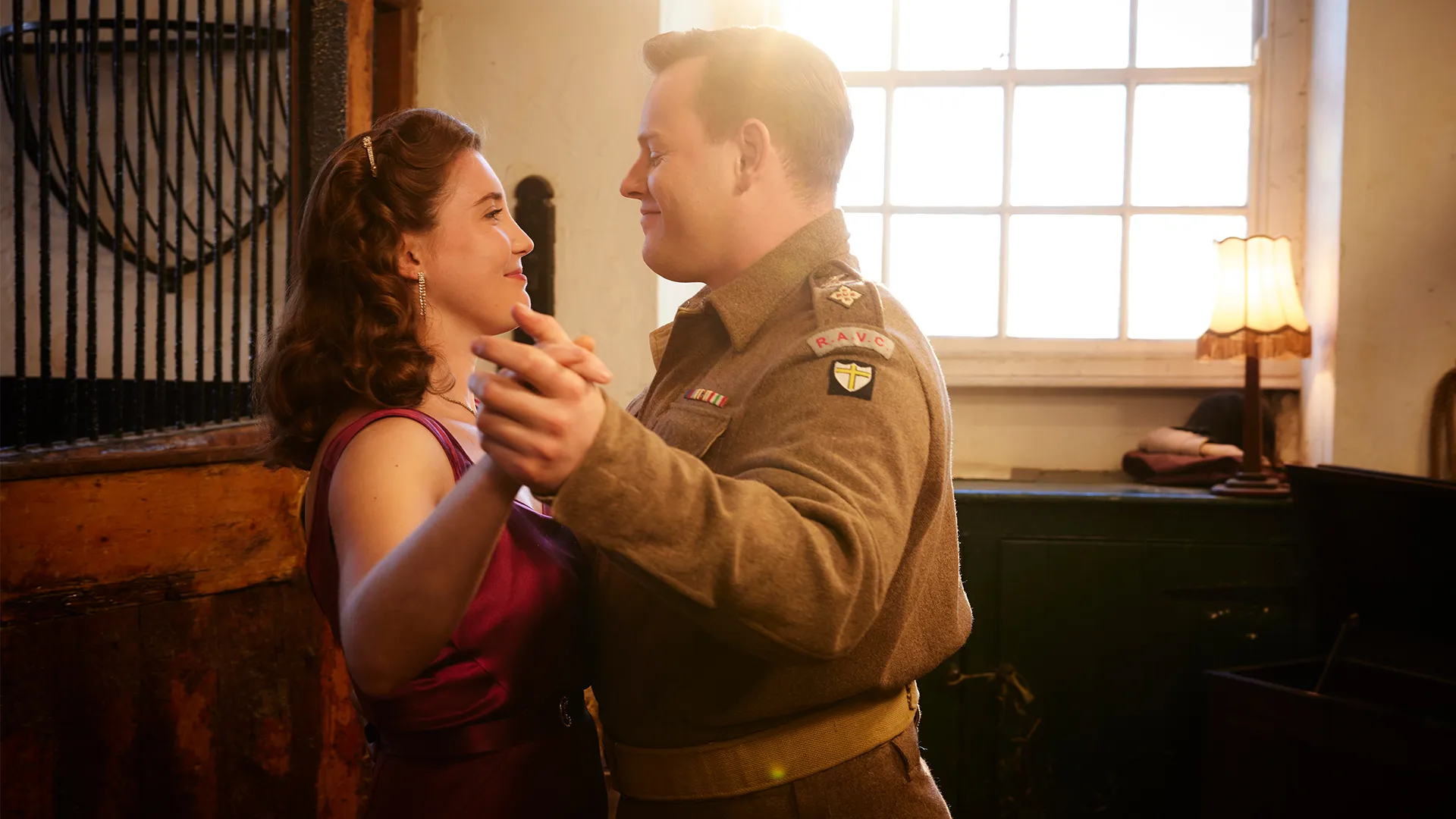 Callum Woodhouse as Tristan Farnon and Gaia Wise as Charlotte Beauvoir in All Creatures Great and Small Season 6 on MASTERPIECE on PBS.